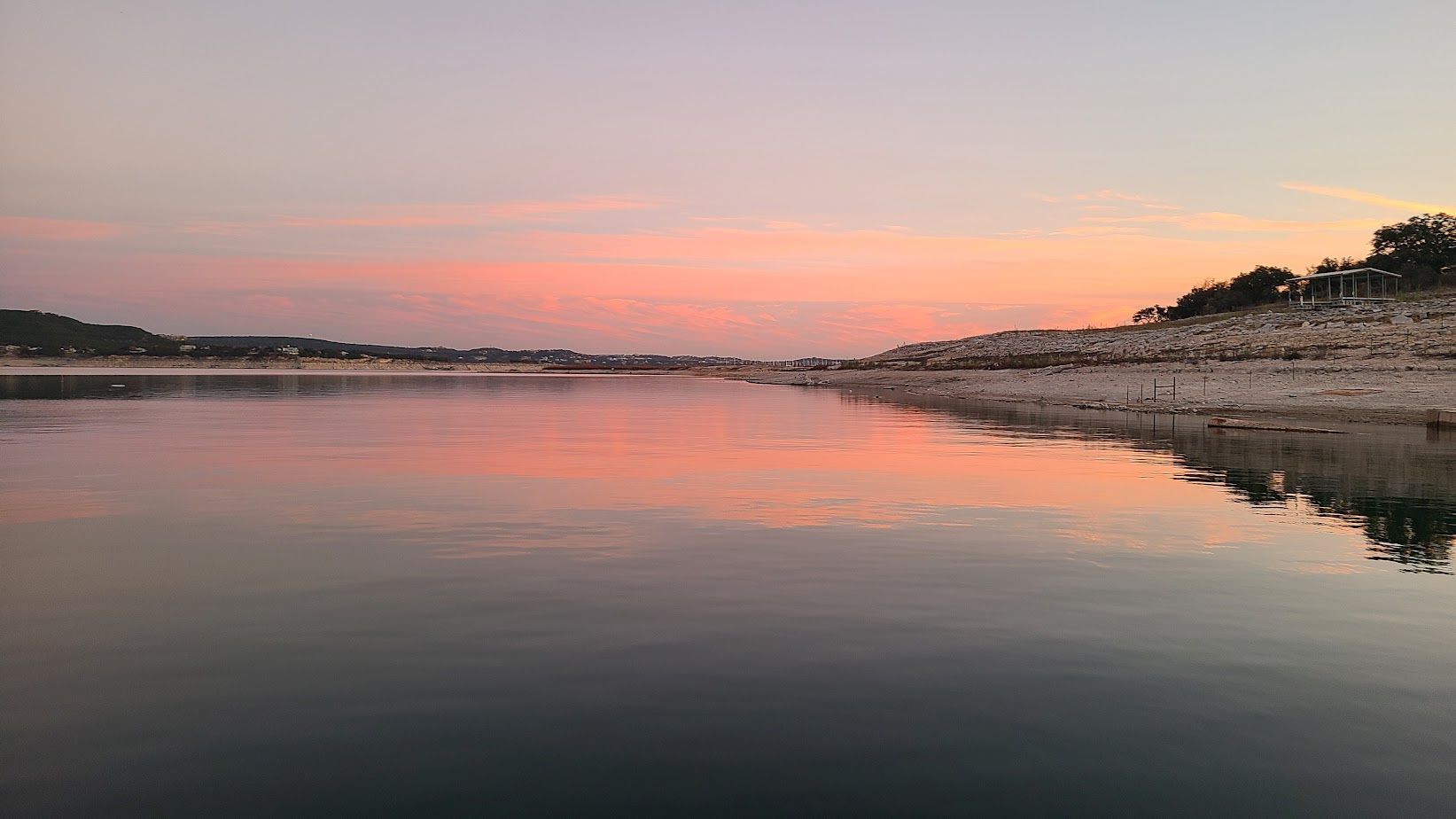 A sunset viewed from a pontoon boat on our sunset cruise on Lake Travis in Austin Texas TX