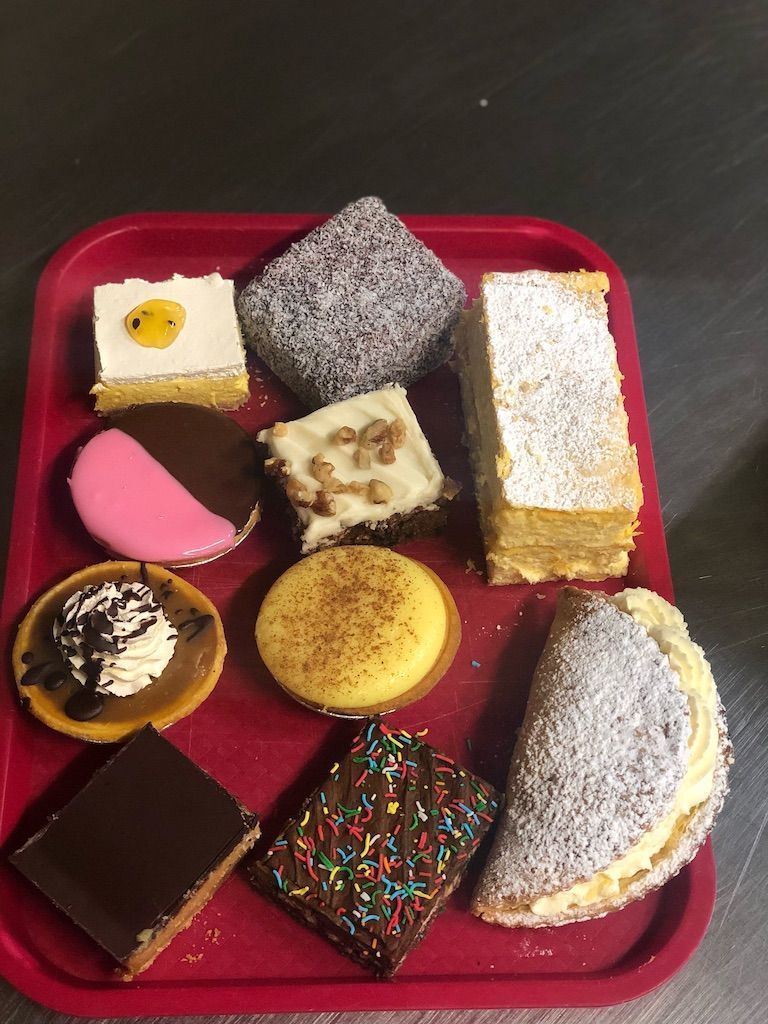 Assorted Cakes on Red Tray — Coffee, Cakes & Pies in Gloucester in Gloucester, NSW