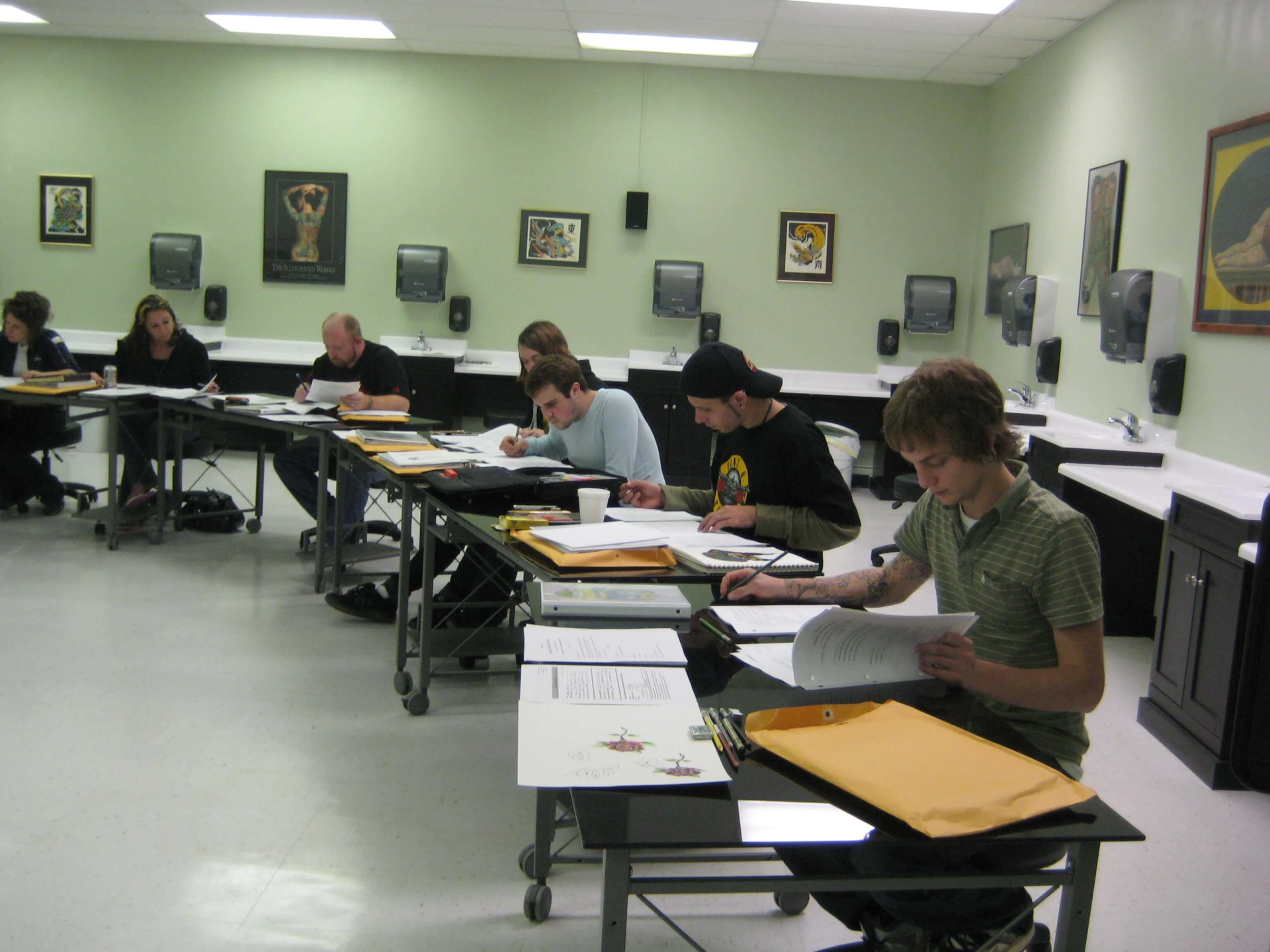 Home World S Only Tattoo School   Students Reading In Classroom 1920w 