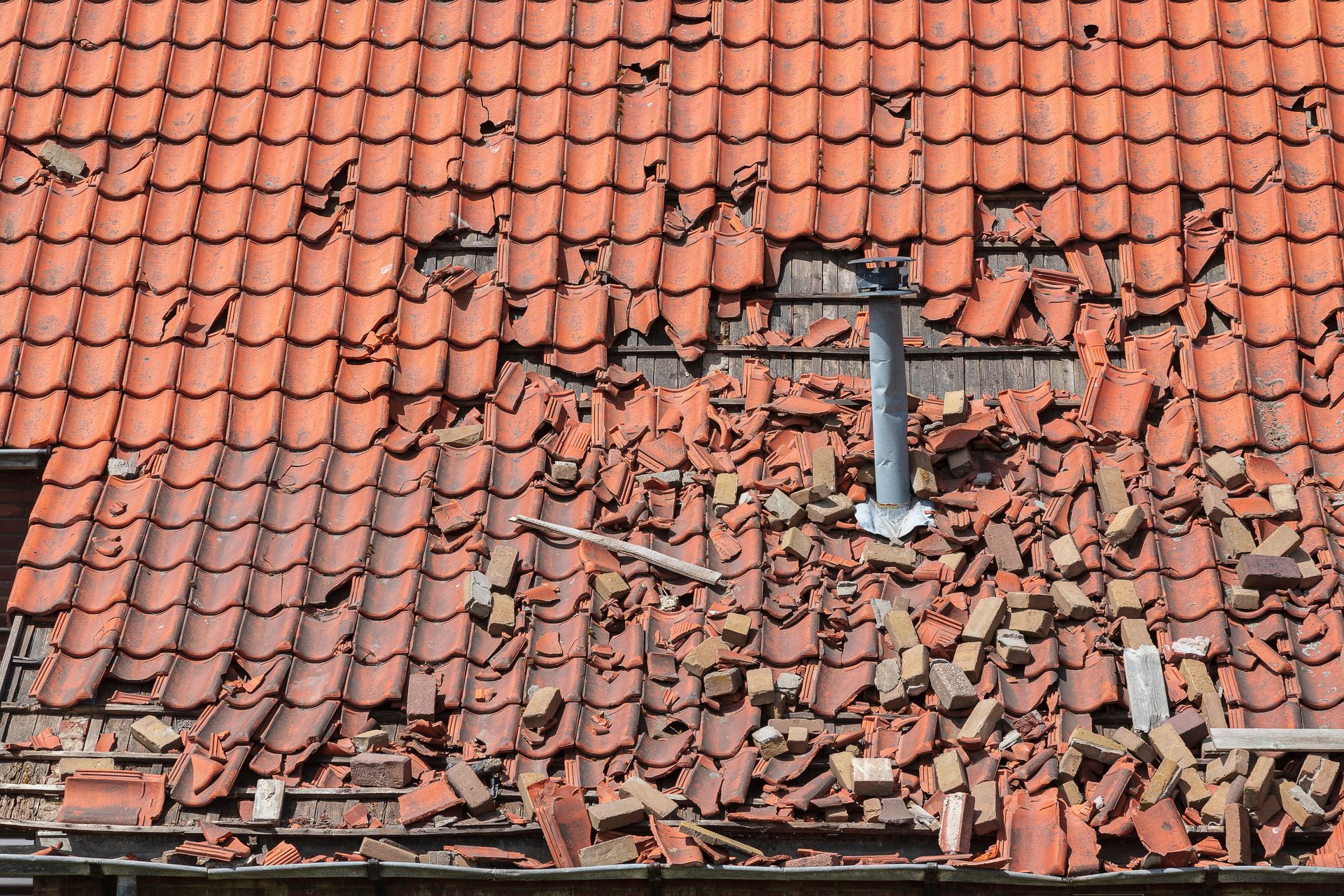Roof storm damage to a residential roof