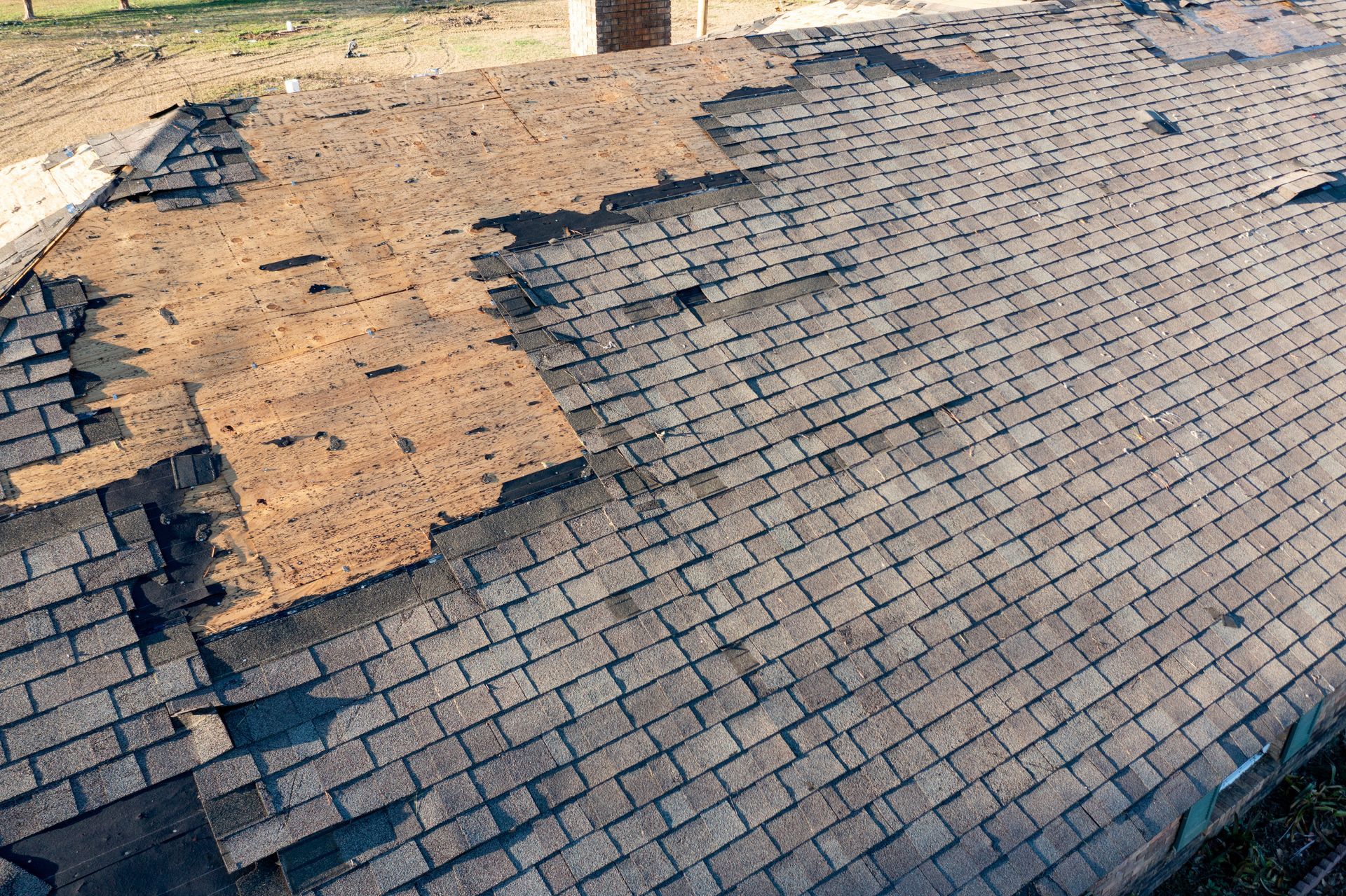 Damaged Roof Shingles After a Storm