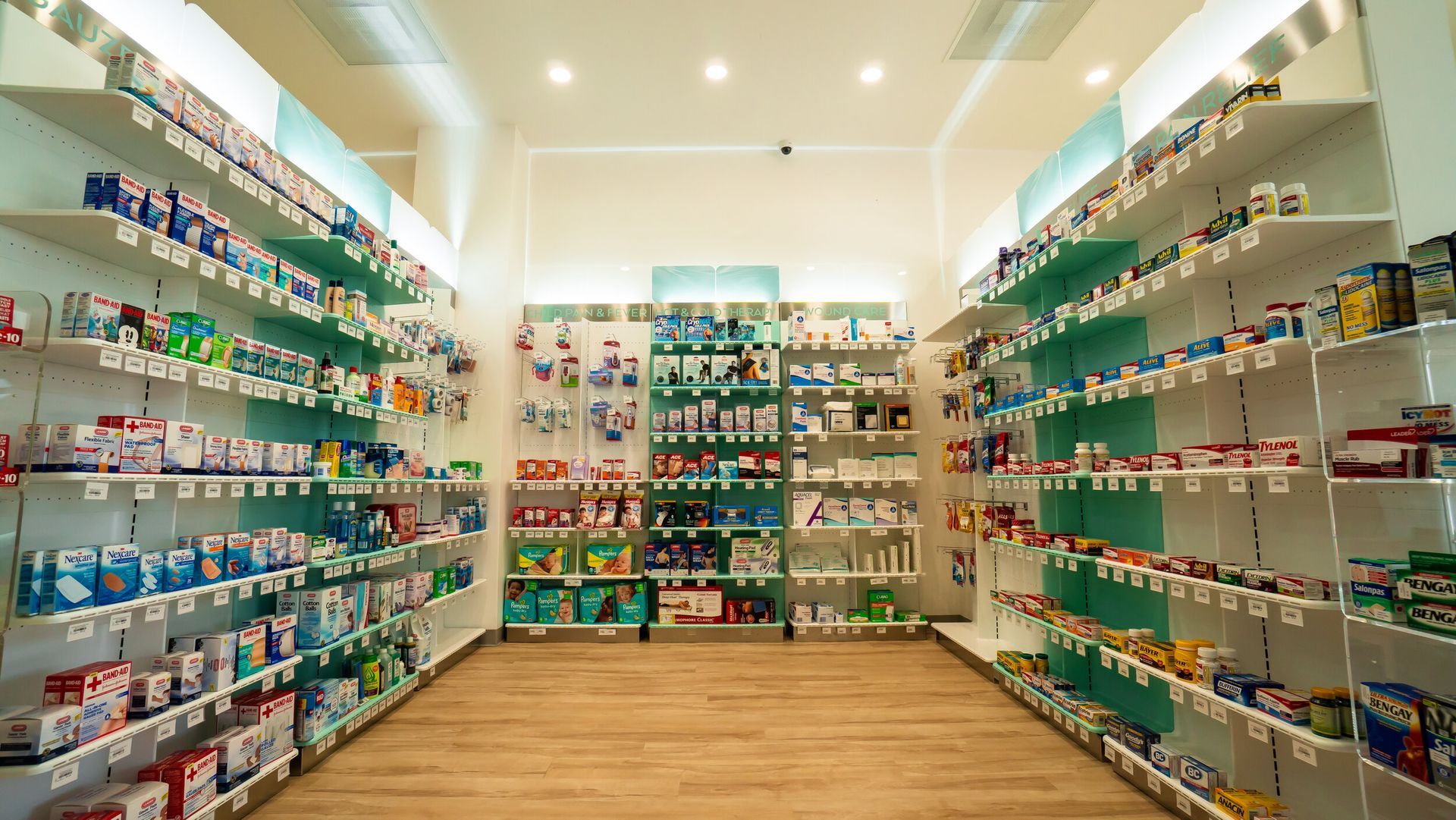 The inside of a pharmacy filled with lots of products on shelves.