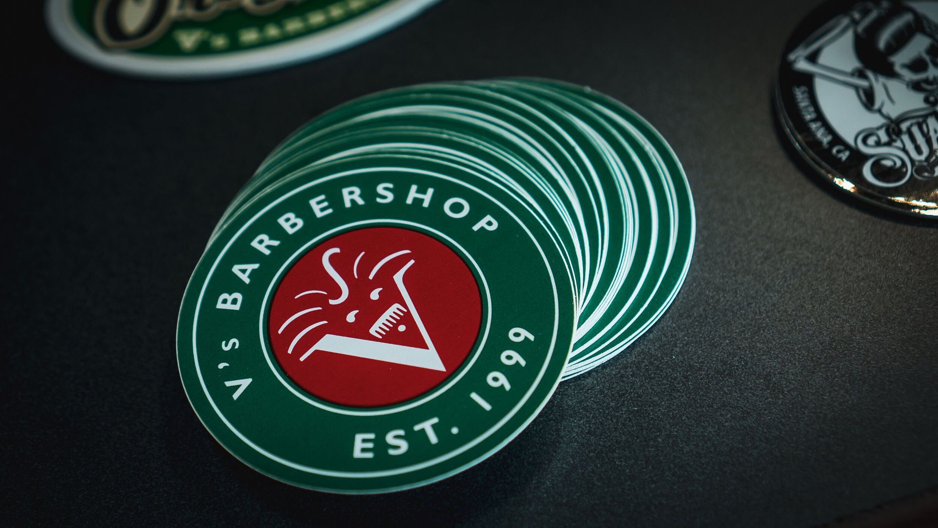 A stack of stickers for a barber shop