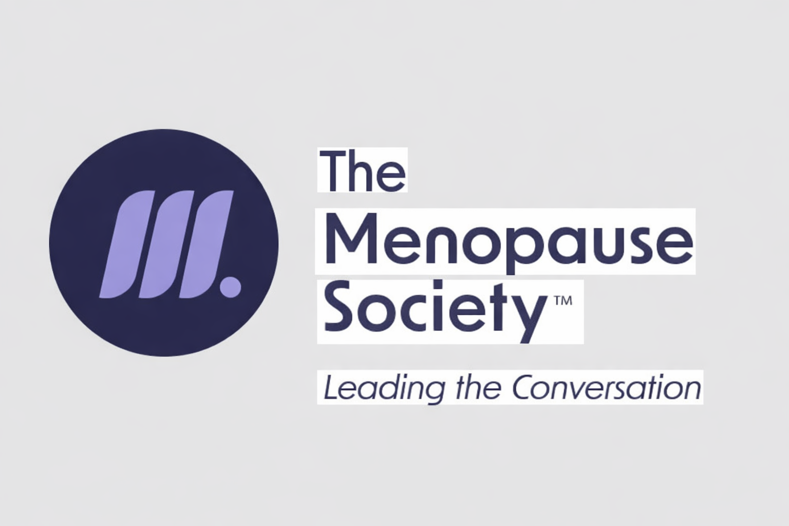 Three women hugging and smiling in a gym setting.