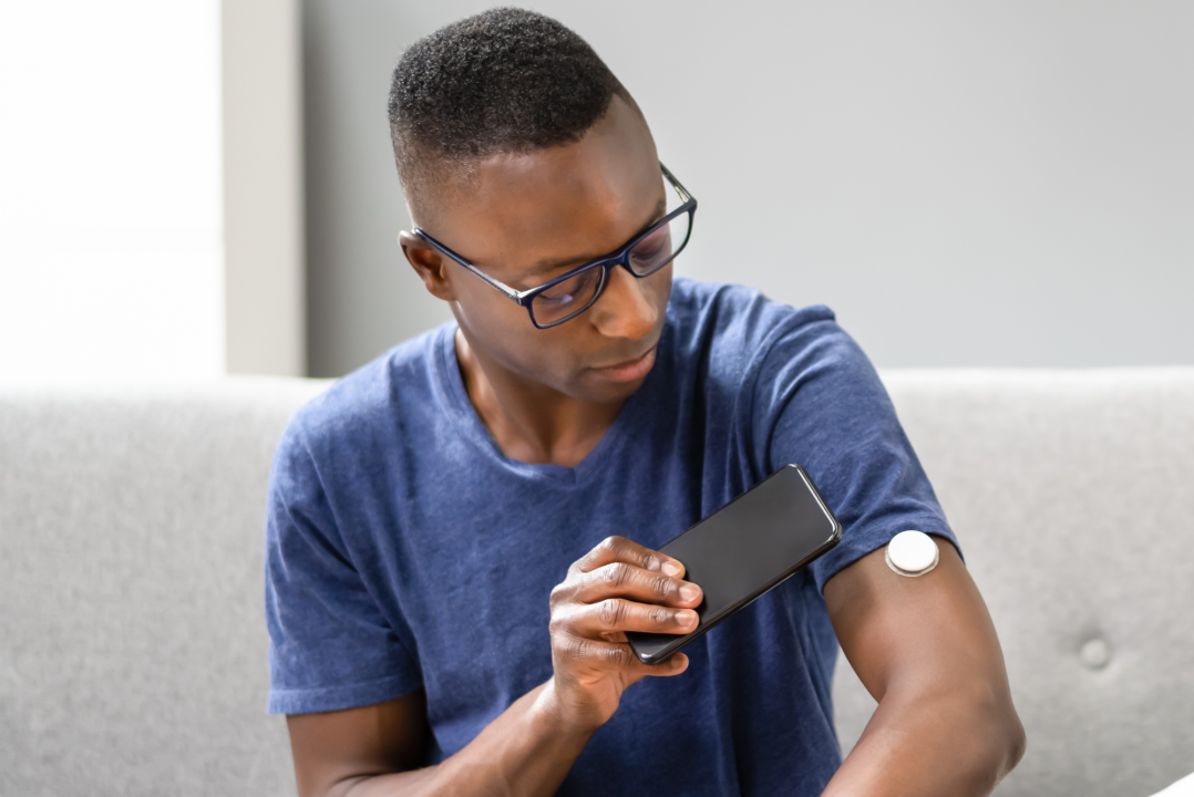 patient using a glucose monitor
