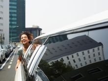woman riding a limousine