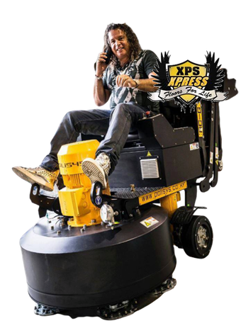 A person sitting on a yellow and black industrial floor grinder, talking on a phone, with an XPS Xpress logo in the back.
