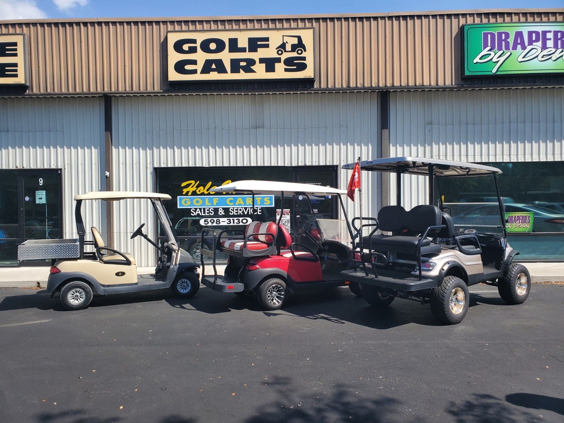 Used golf carts in beige, red, and silver Hole In One Golf Carts
