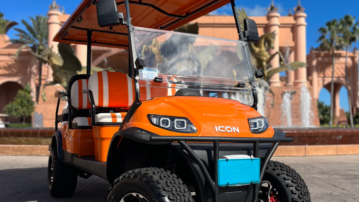 Coral Orange lifted 6-passenger LSV ICON golf cart