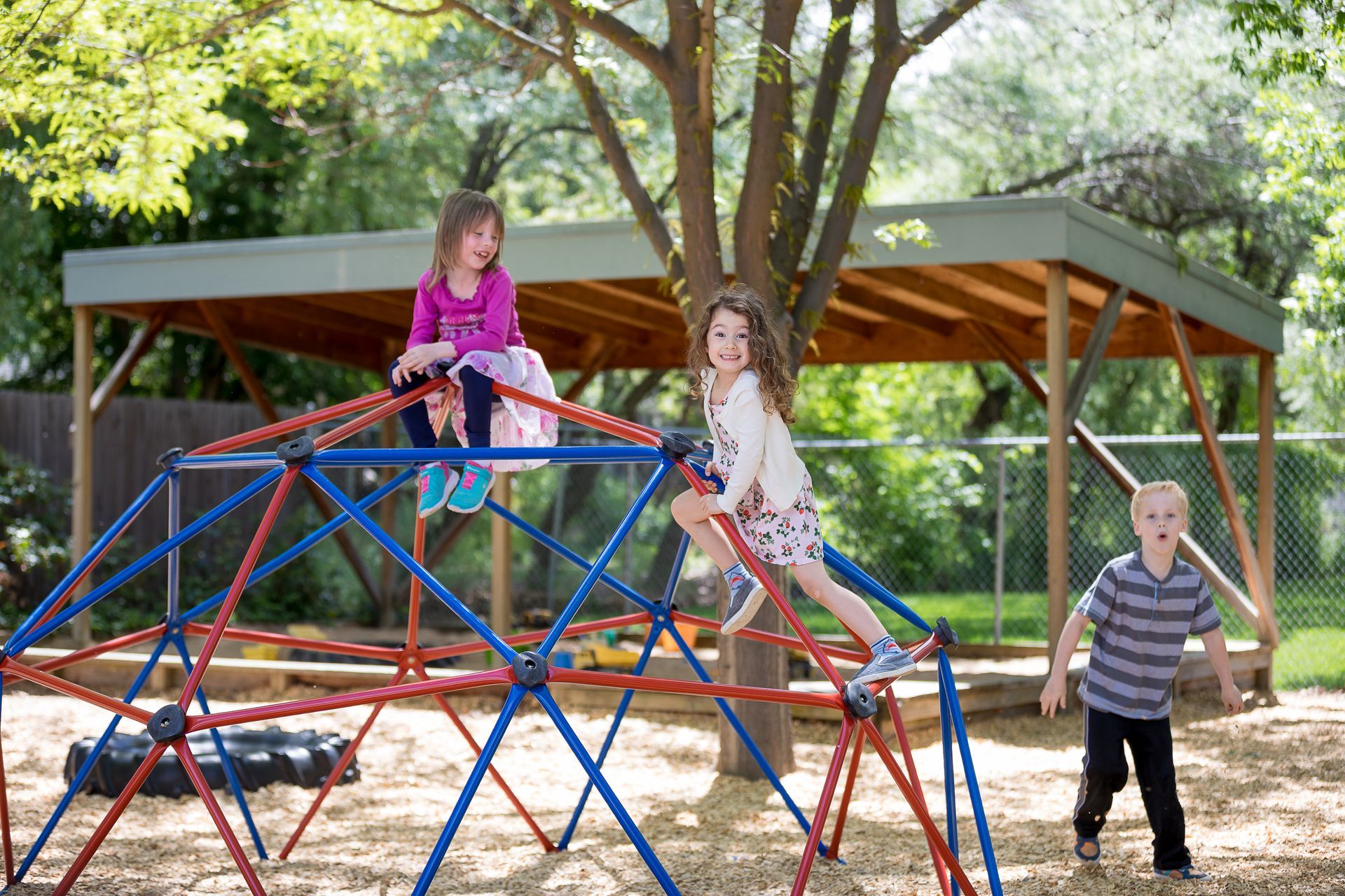 a man and a little girl are gathering leaves in a bag that says download our mobile app