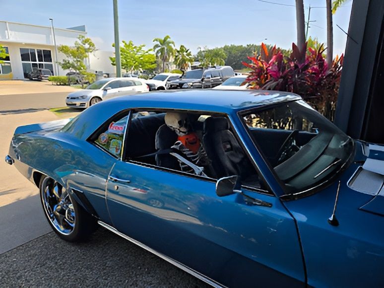 A Blue Car is Parked on the Side of the Road — Aitkenvale Auto & Dyno in Aitkenvale, QLD