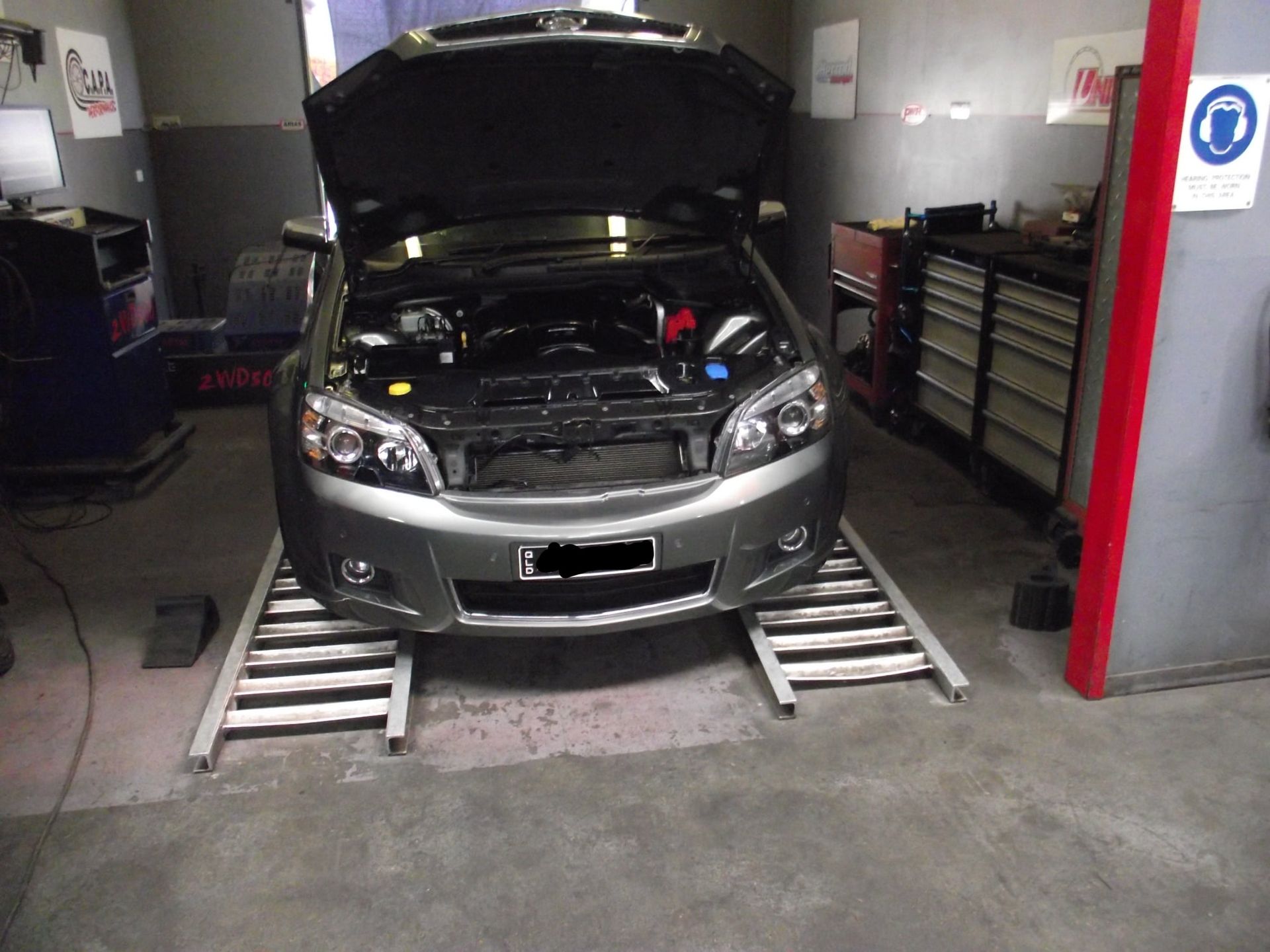 A Person is Working on the Radiator of a Car — Aitkenvale Auto & Dyno in Aitkenvale, QLD