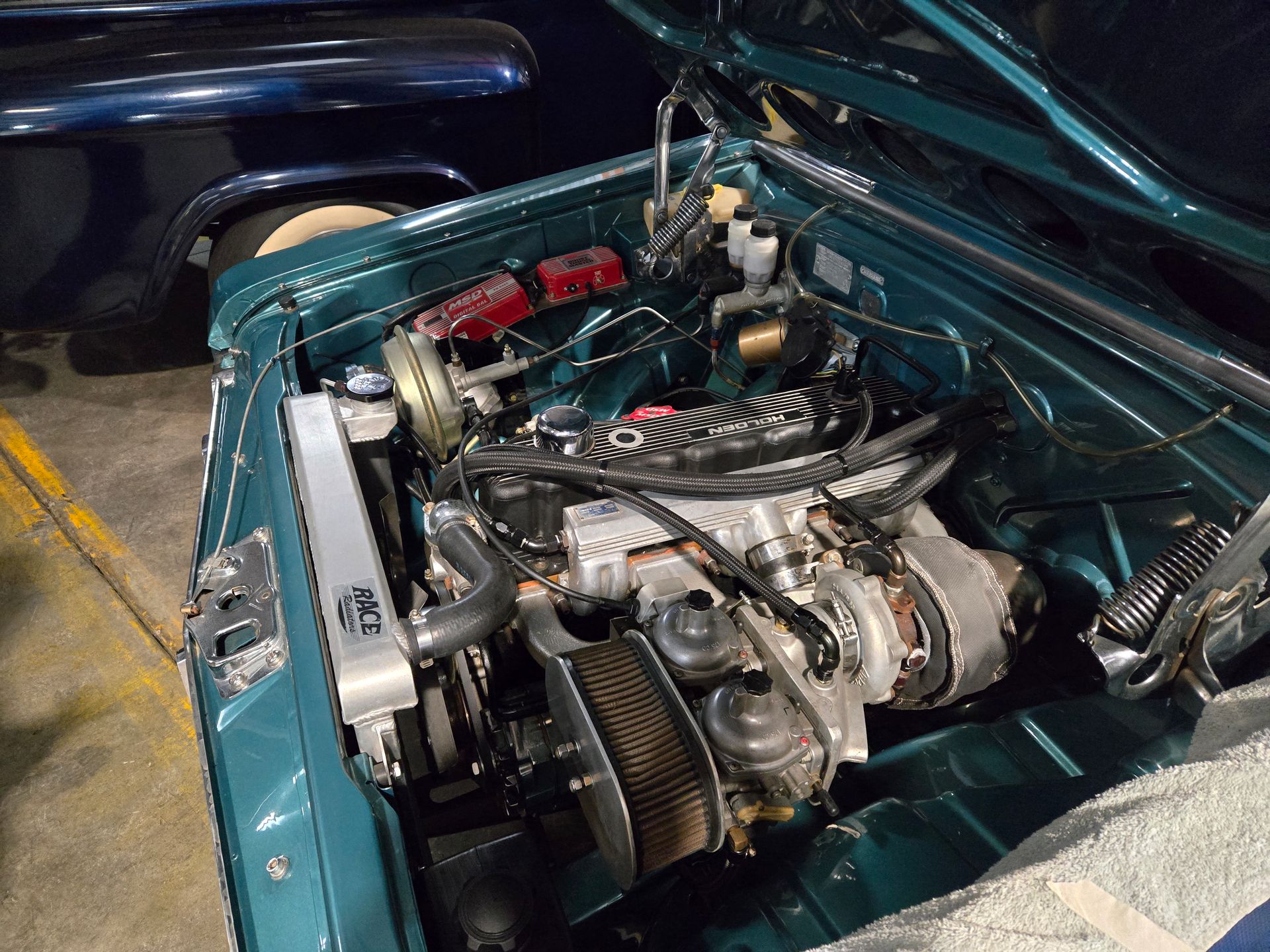 A Green Car with Carburettors — Aitkenvale Auto & Dyno in Aitkenvale, QLD