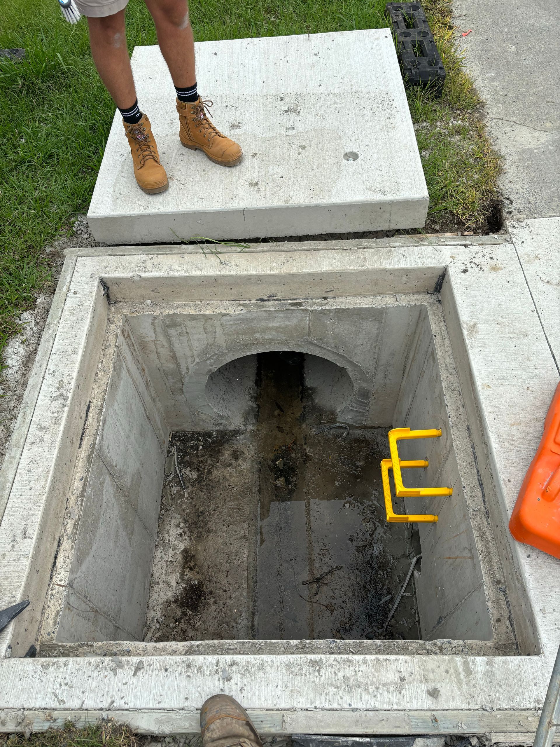 A Kitchen With A Sink And A Hose Underneath It — Coastal Plumbing Group in Woolgoolga, NSW