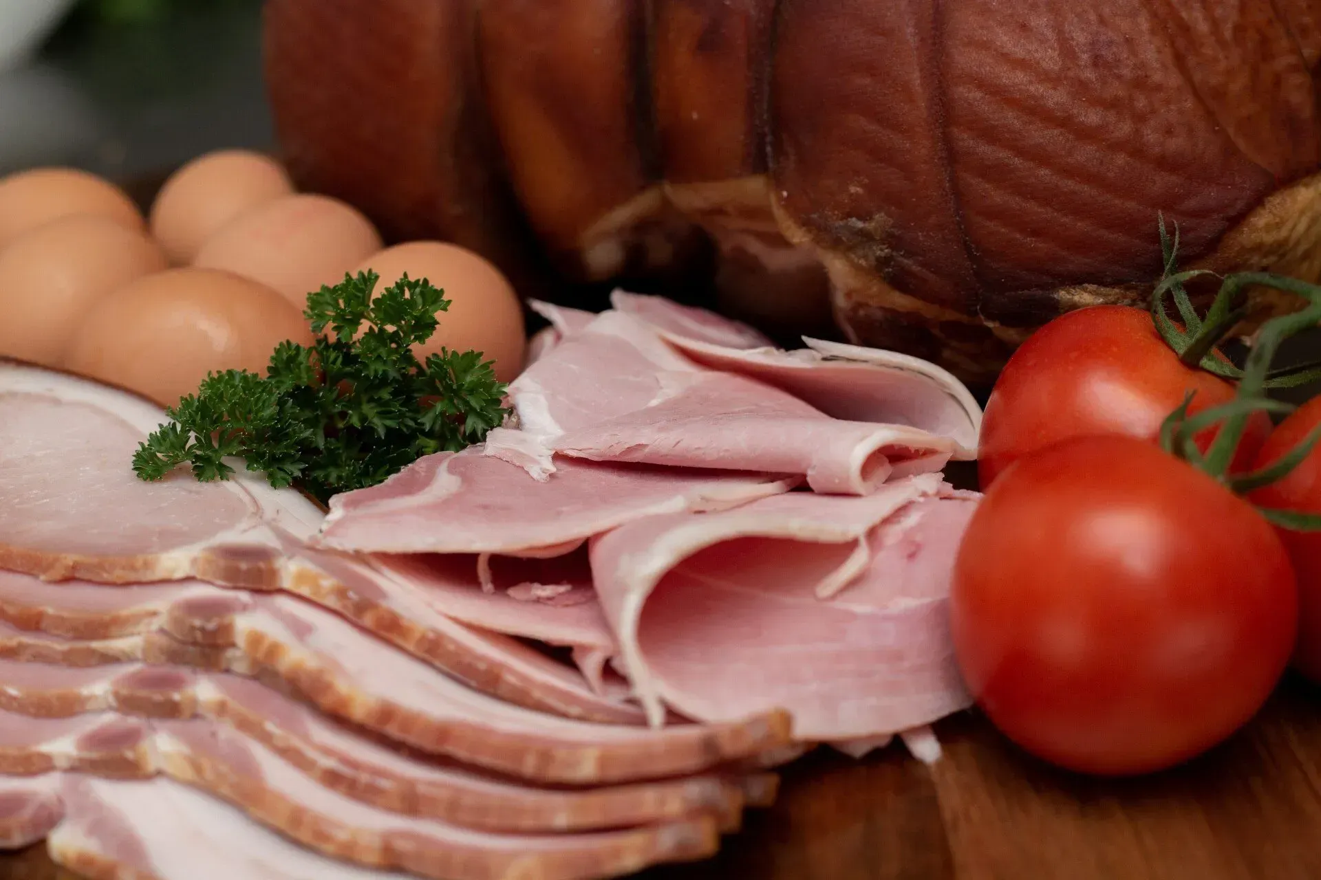 Close-up of Breakfast Ingredients: Sliced Ham, Bacon, Eggs, Tomatoes  — Lighthouse Meat & Poultry In Port Macquarie, NSW