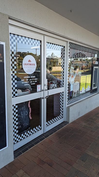 Lighthouse Cafe Storefront With Checkered Trim and an Open Door  — Lighthouse Meat & Poultry In Port Macquarie, NSW
