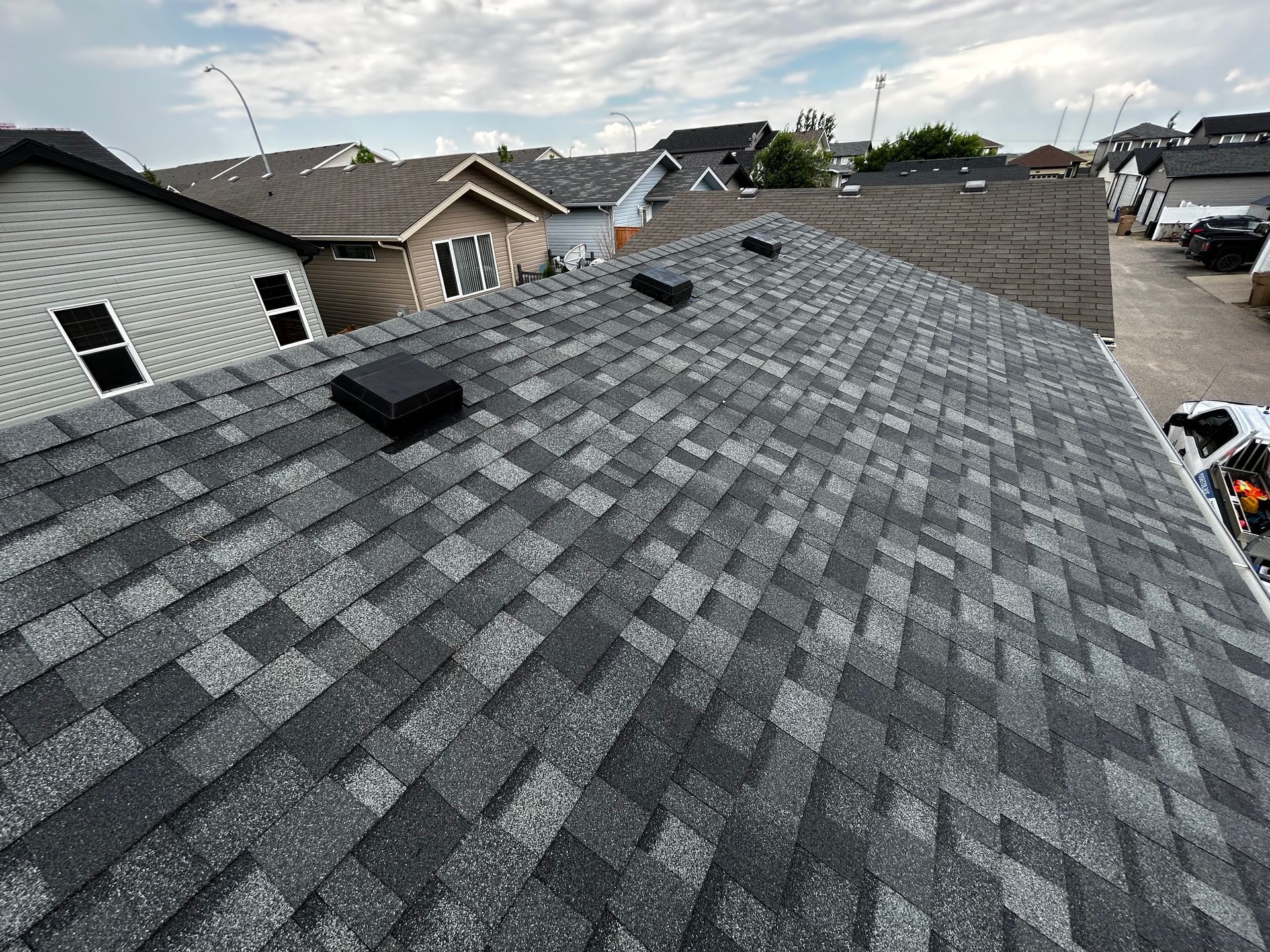 a roof of a house with a lot of shingles on it .