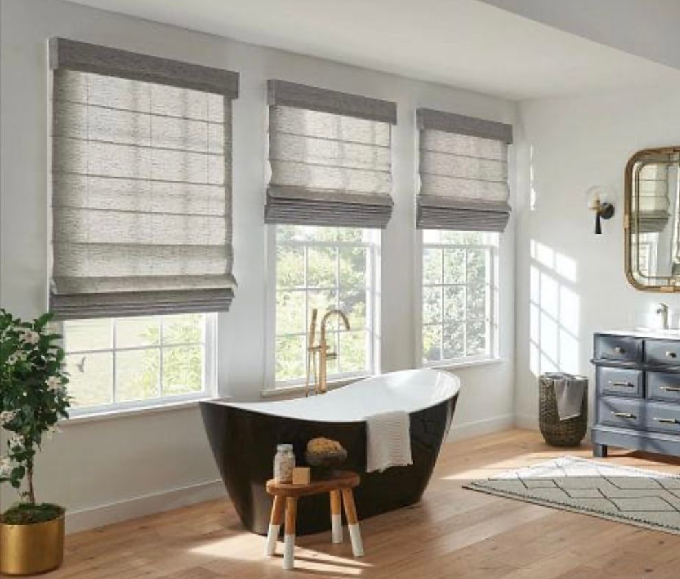 3 custom grey roman shades in designer bathroom.