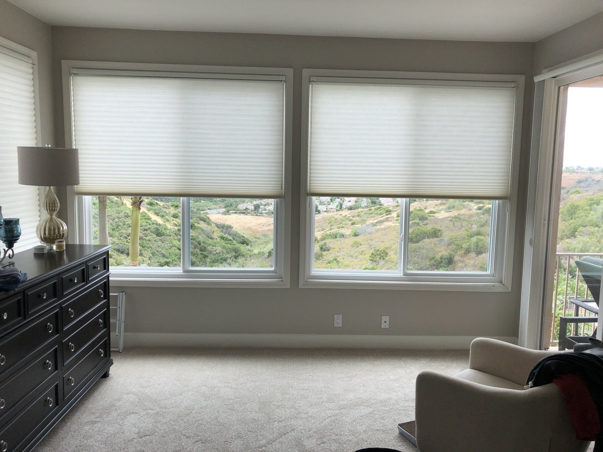 Off White Duette shades installed in customers master bedroom in Carlsbad, CA