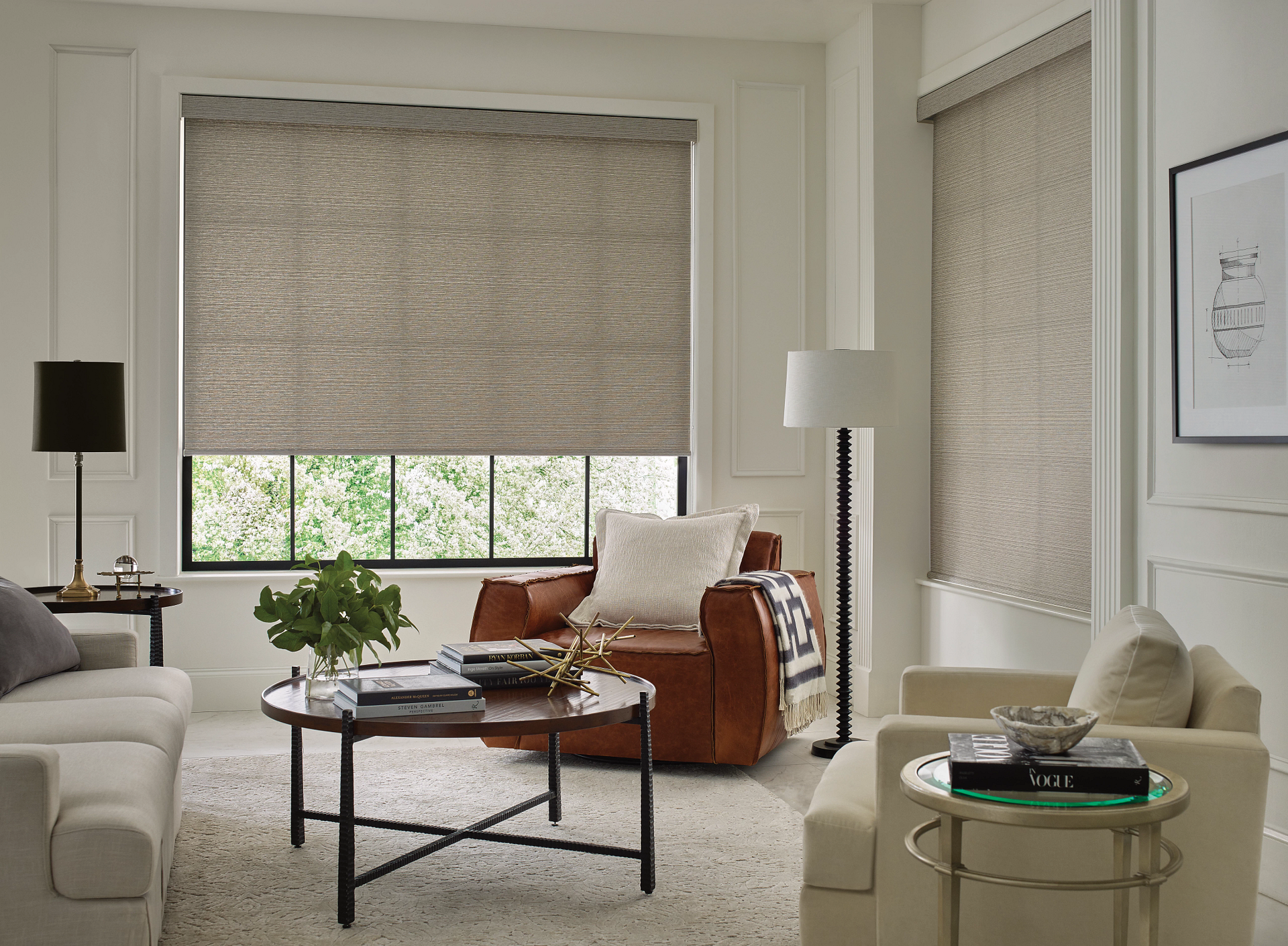 A living room with a roller shades by Window Spaces in Carlsbad, CA