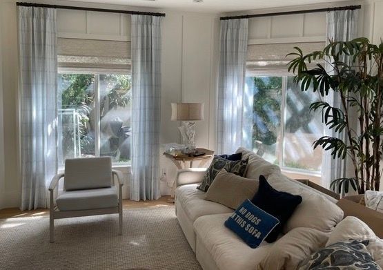 Encinitas clients Living room with sheer blue curtains and woven shades