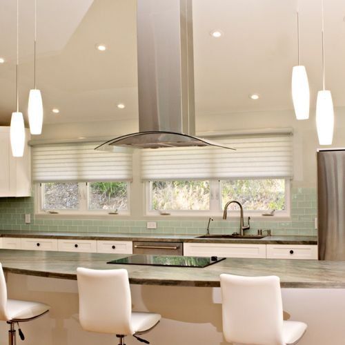 A kitchen with sheer shades