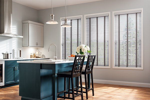 Motorized Silhouette window shadings on large windows for Poway customers