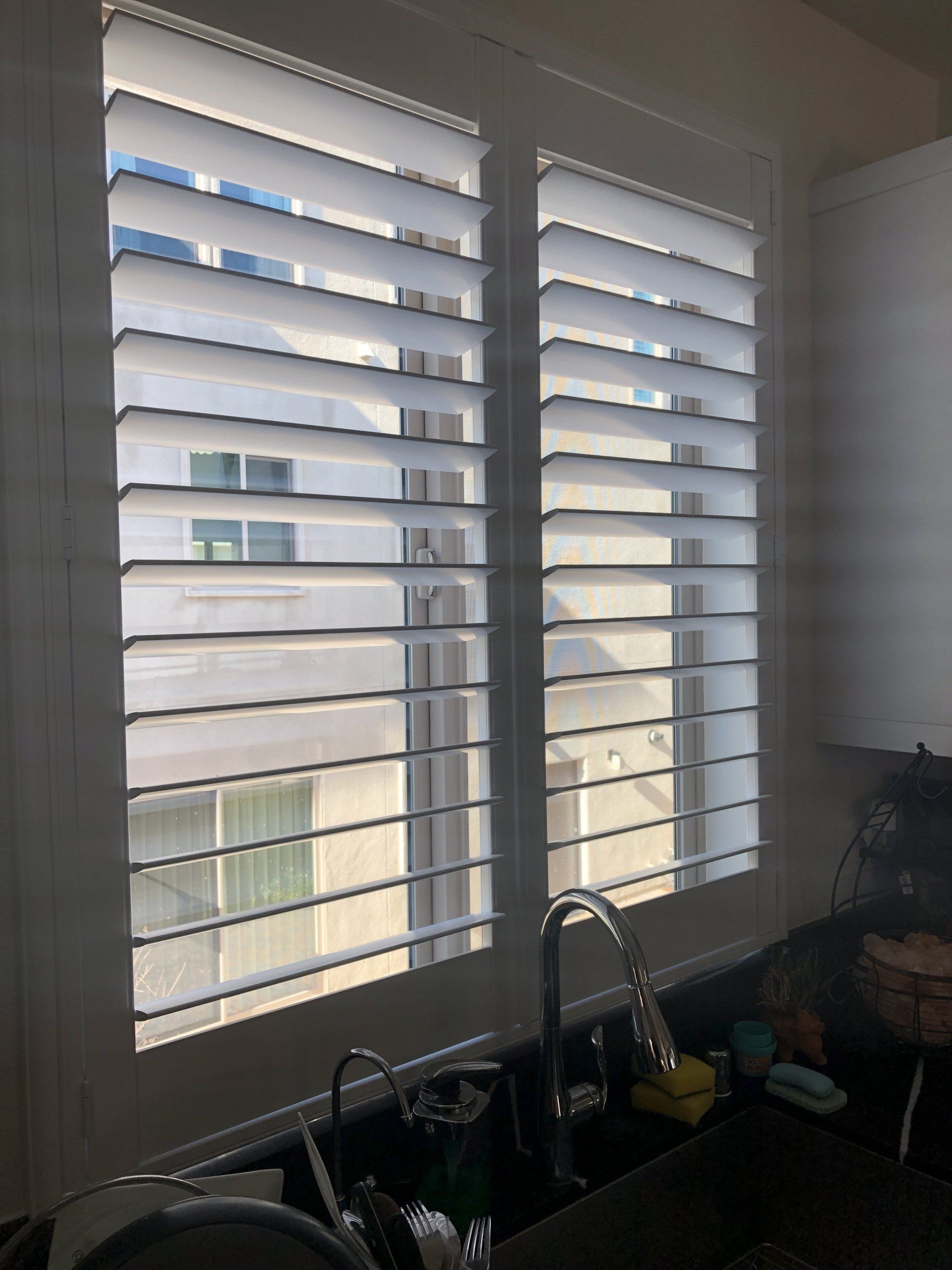 Shutter in Kitchen sink window.