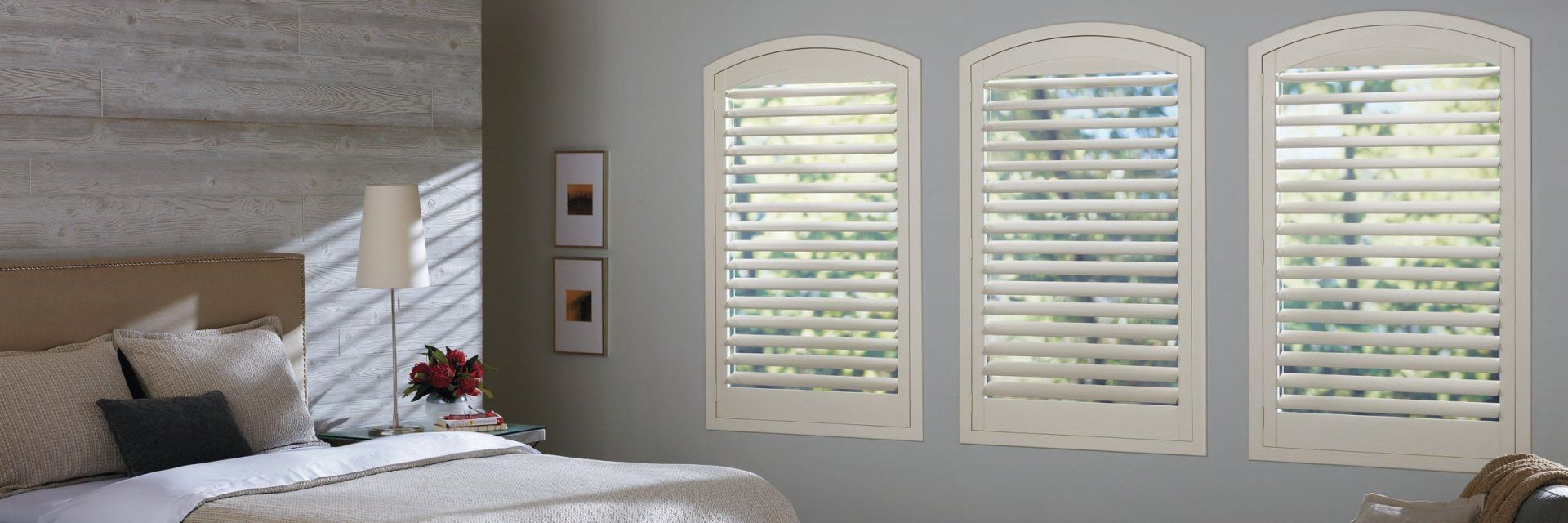 NEWSTYLE® Hybrid Shutters white arched in well designed bedroom