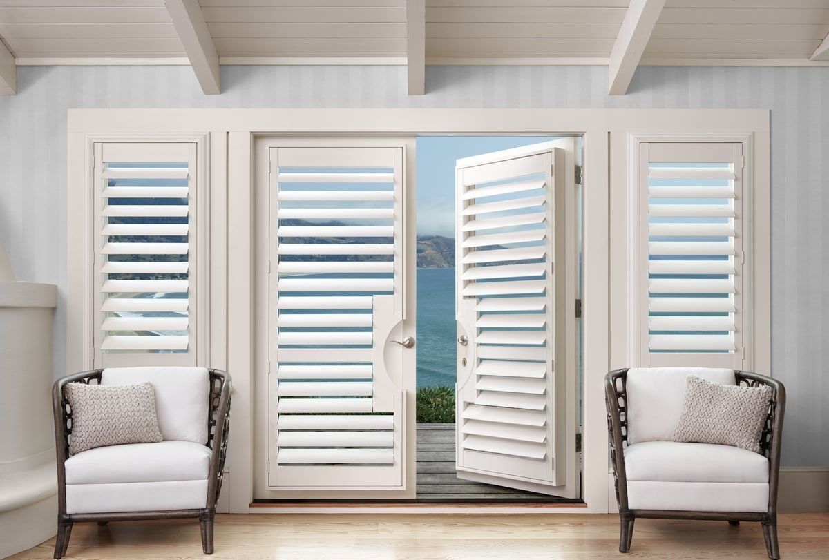Hunter Douglas Palm Beach™  Shutters on windows and french doors,