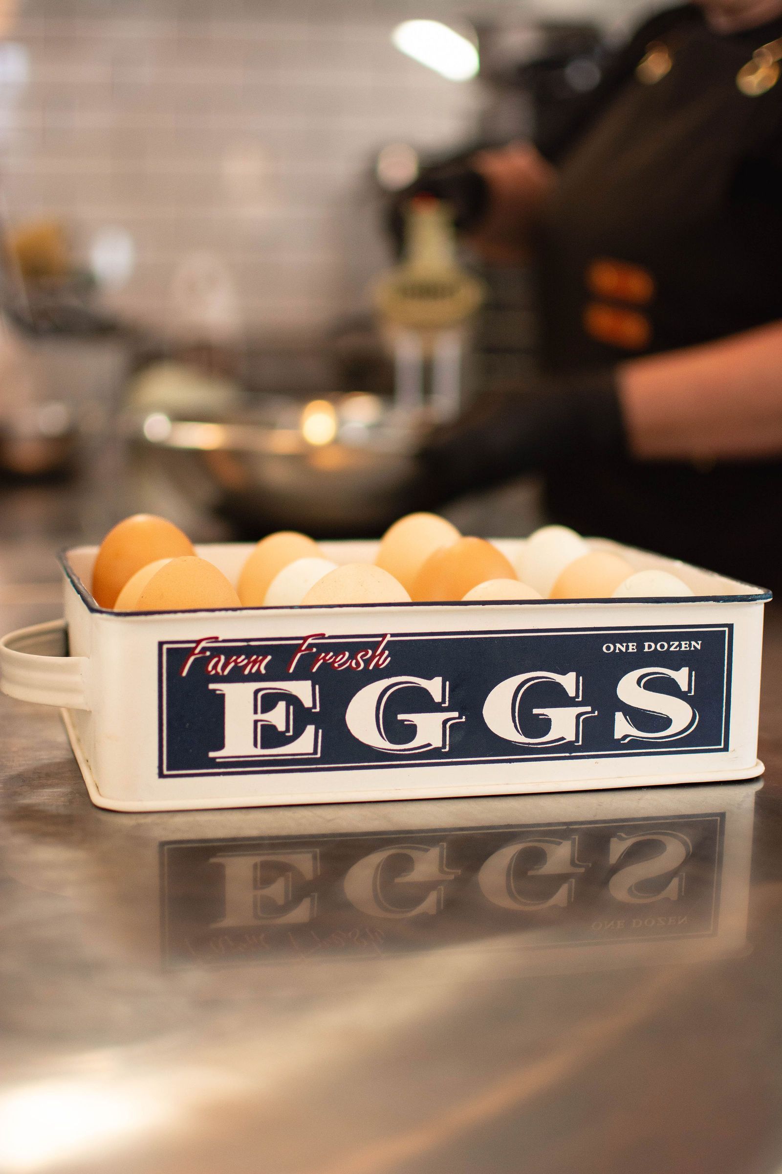 Eggs in a metal container that reads 