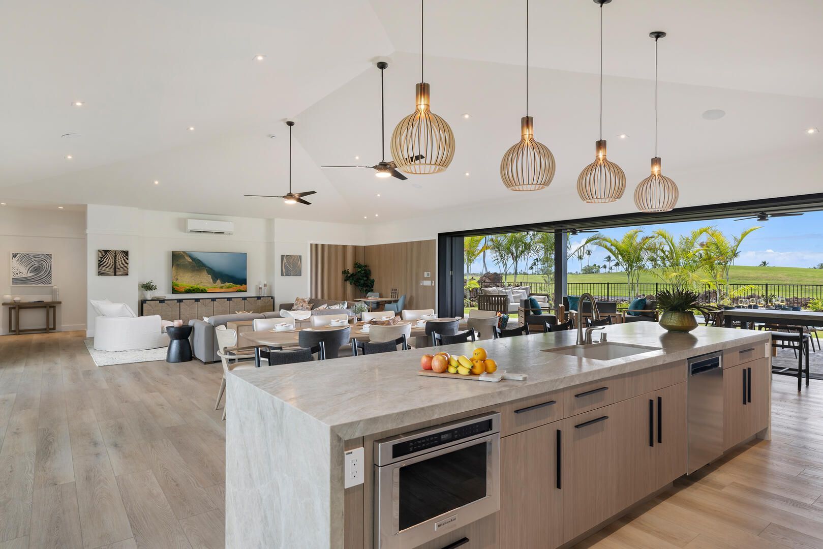 A large kitchen with a large island in the middle of the room.