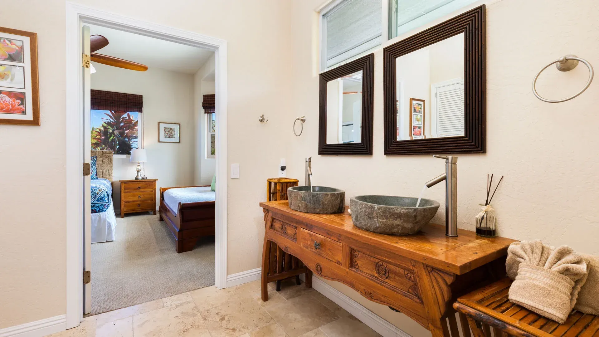 A bathroom with two sinks and two mirrors.
