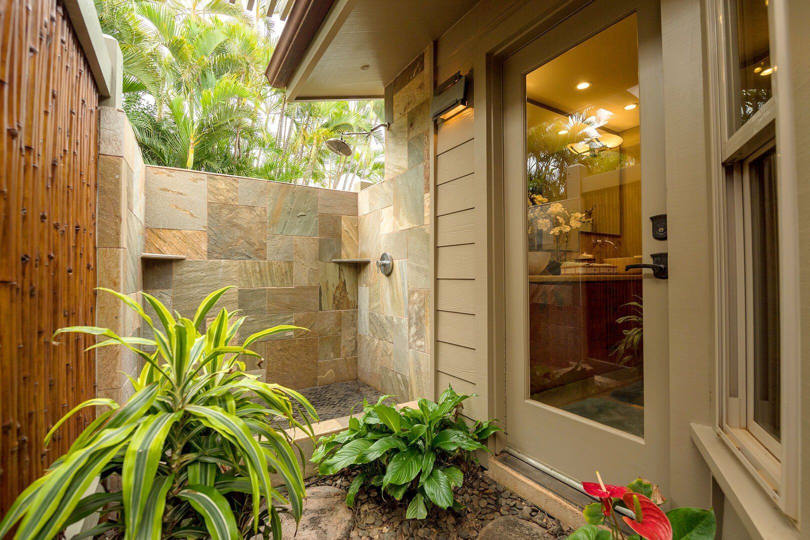 There is a walk in shower outside of the house.