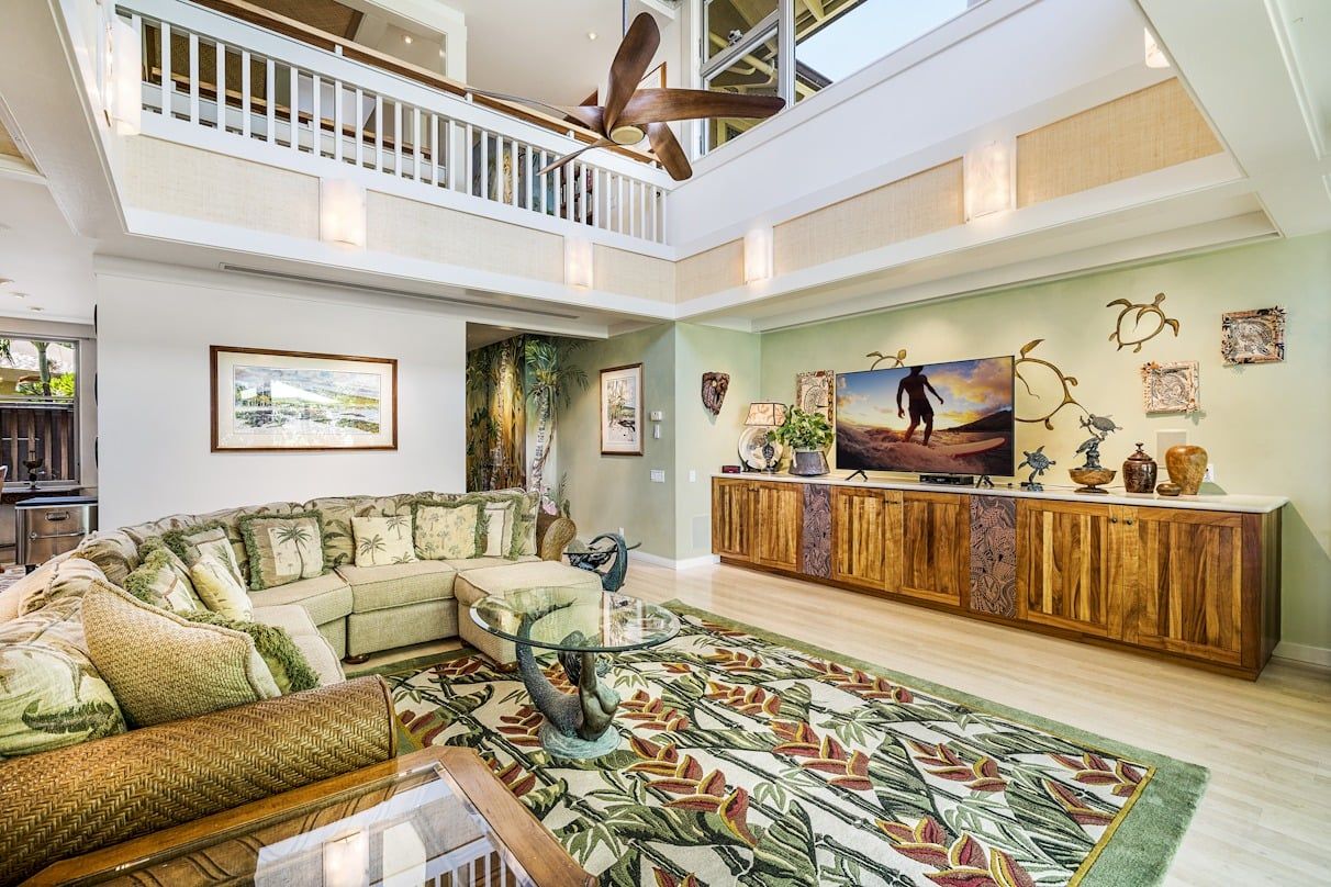 A living room filled with furniture and a flat screen tv.