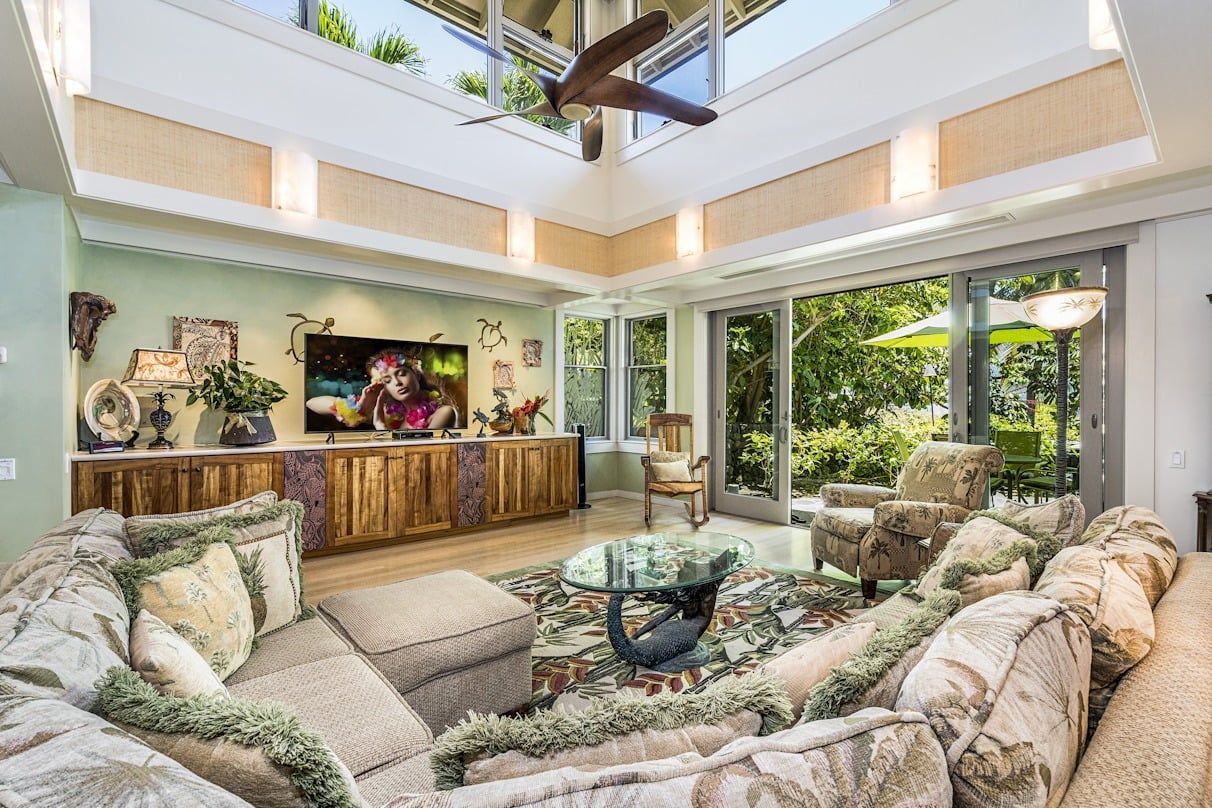 A living room filled with furniture and a flat screen tv.