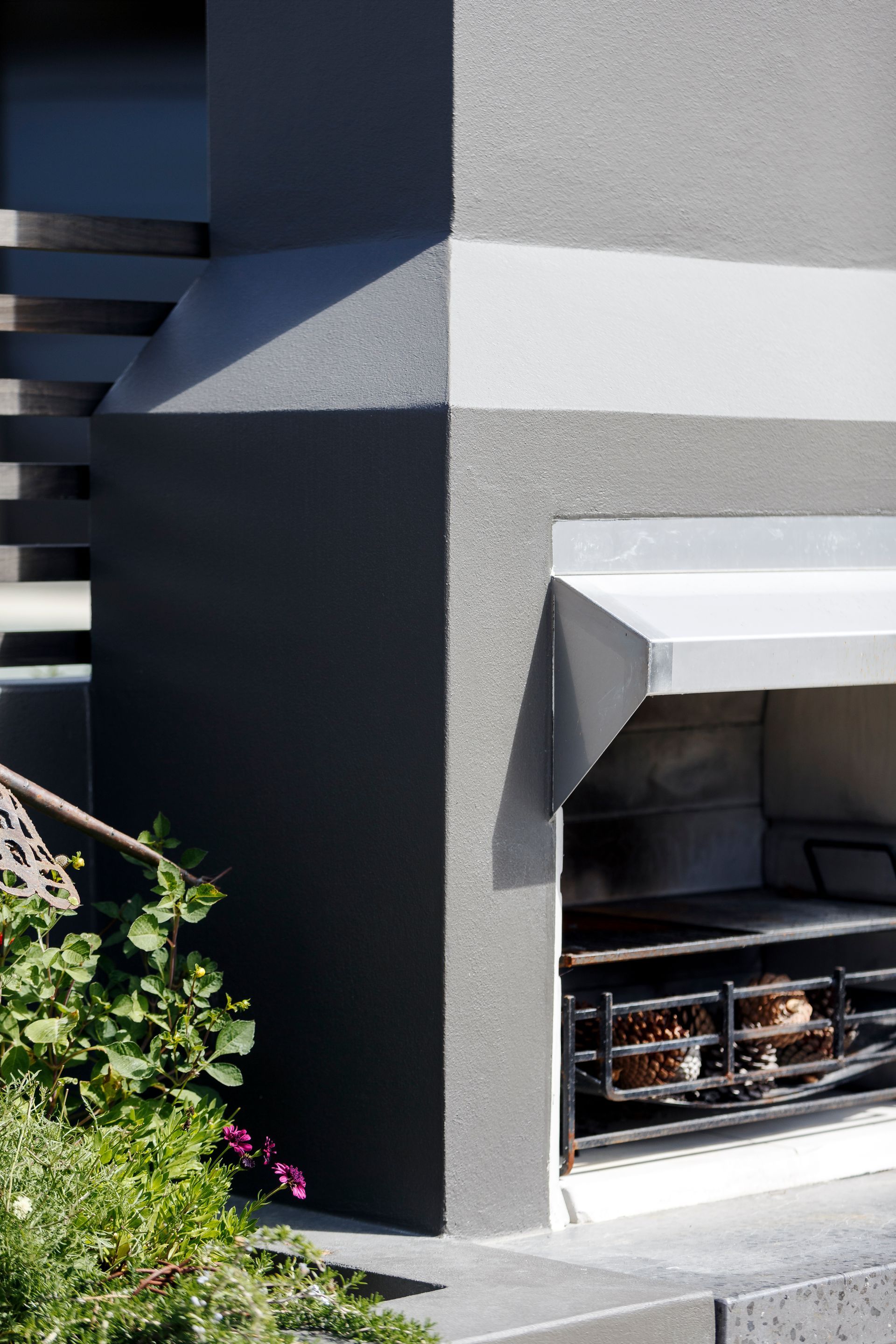 A gray building with a white stripe on the side