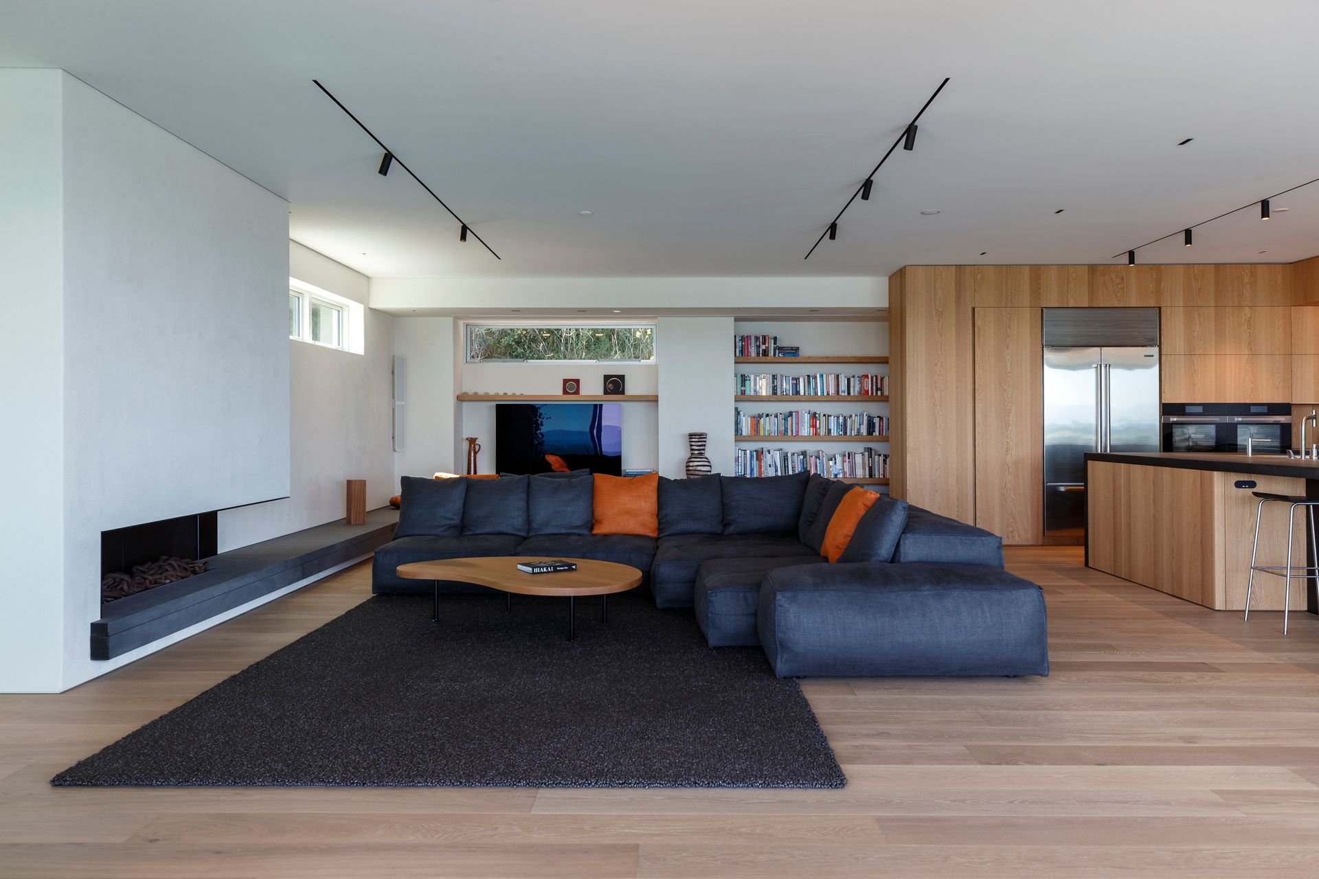 A living room with a sectional couch and a coffee table