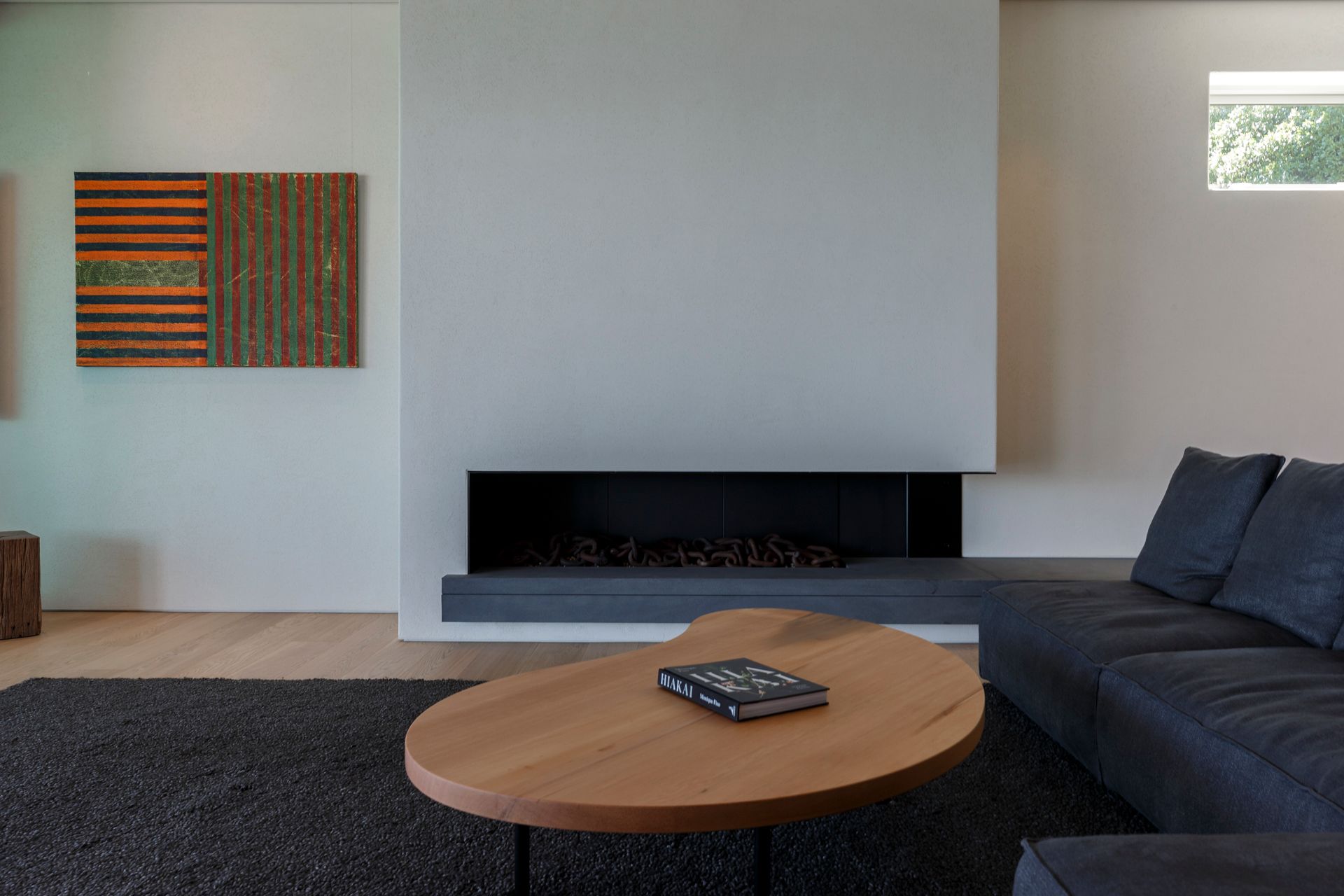 A living room with a couch and a fireplace