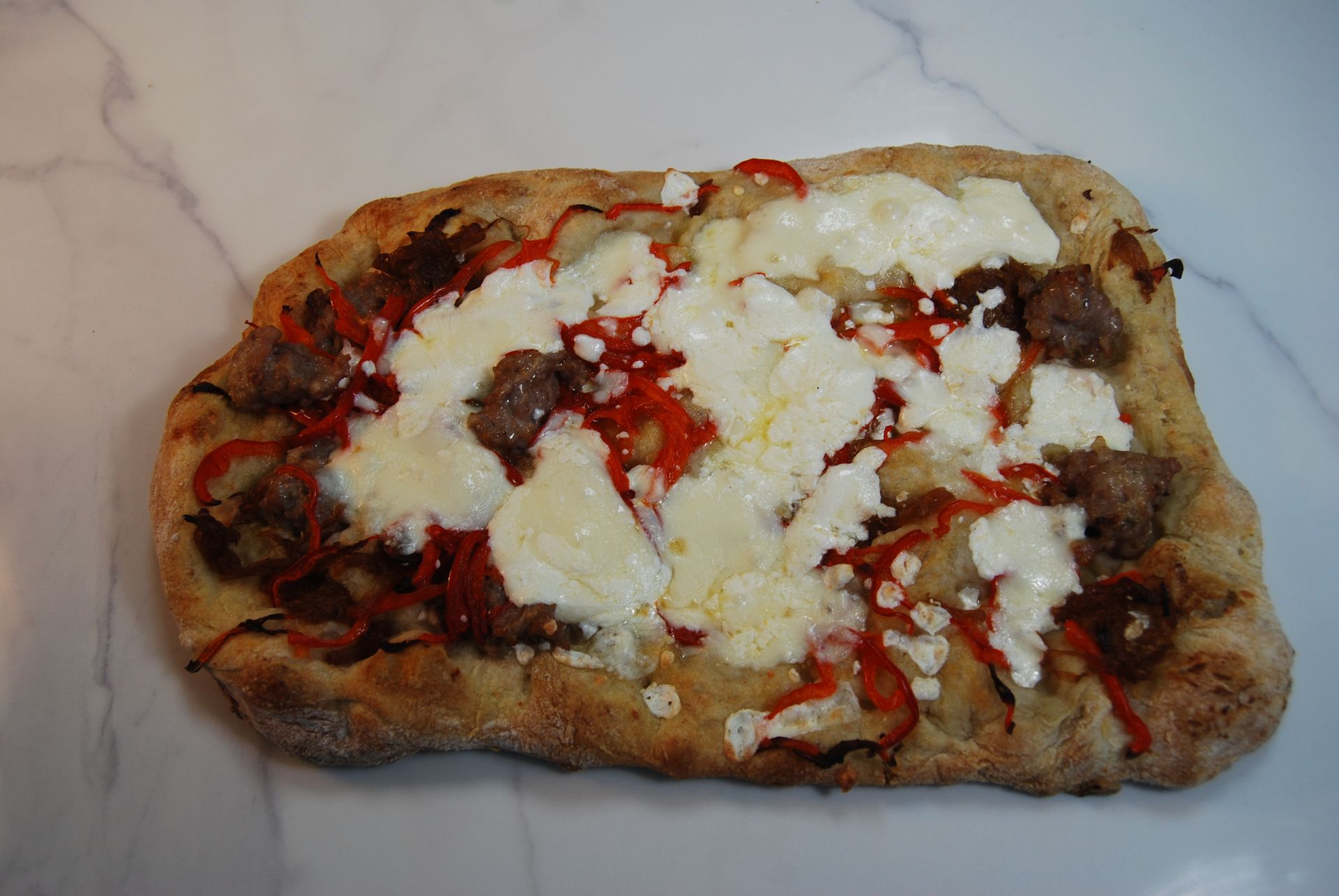 A pizza with a lot of toppings on it