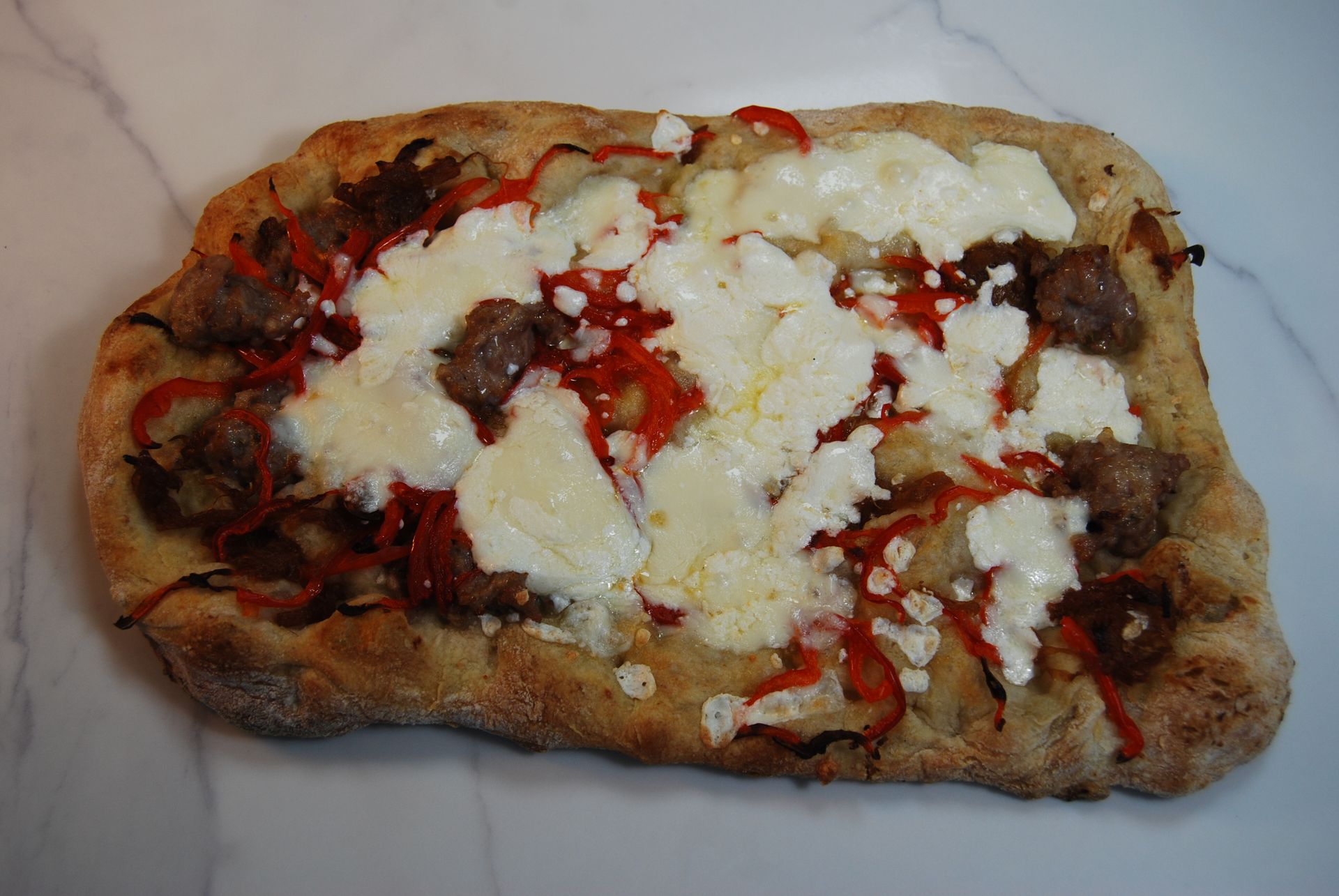 A pizza with a lot of toppings on it