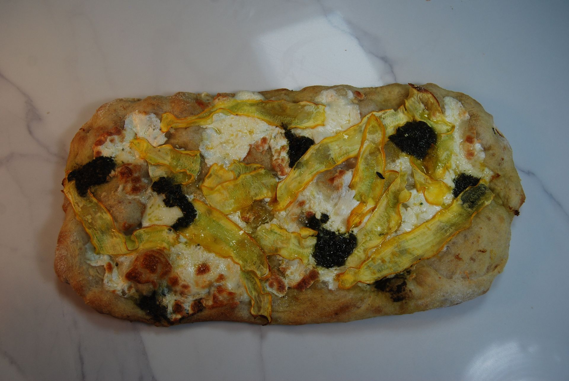 A pizza with a lot of vegetables on it