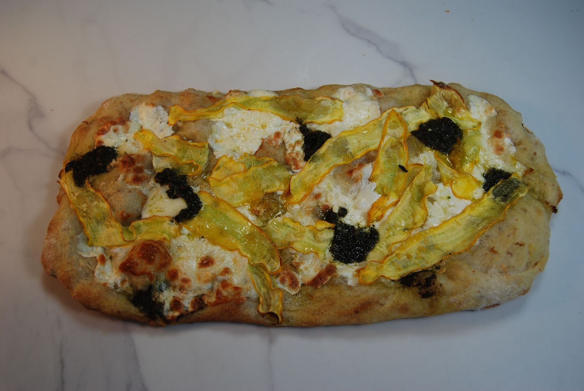 A pizza with a lot of toppings on it