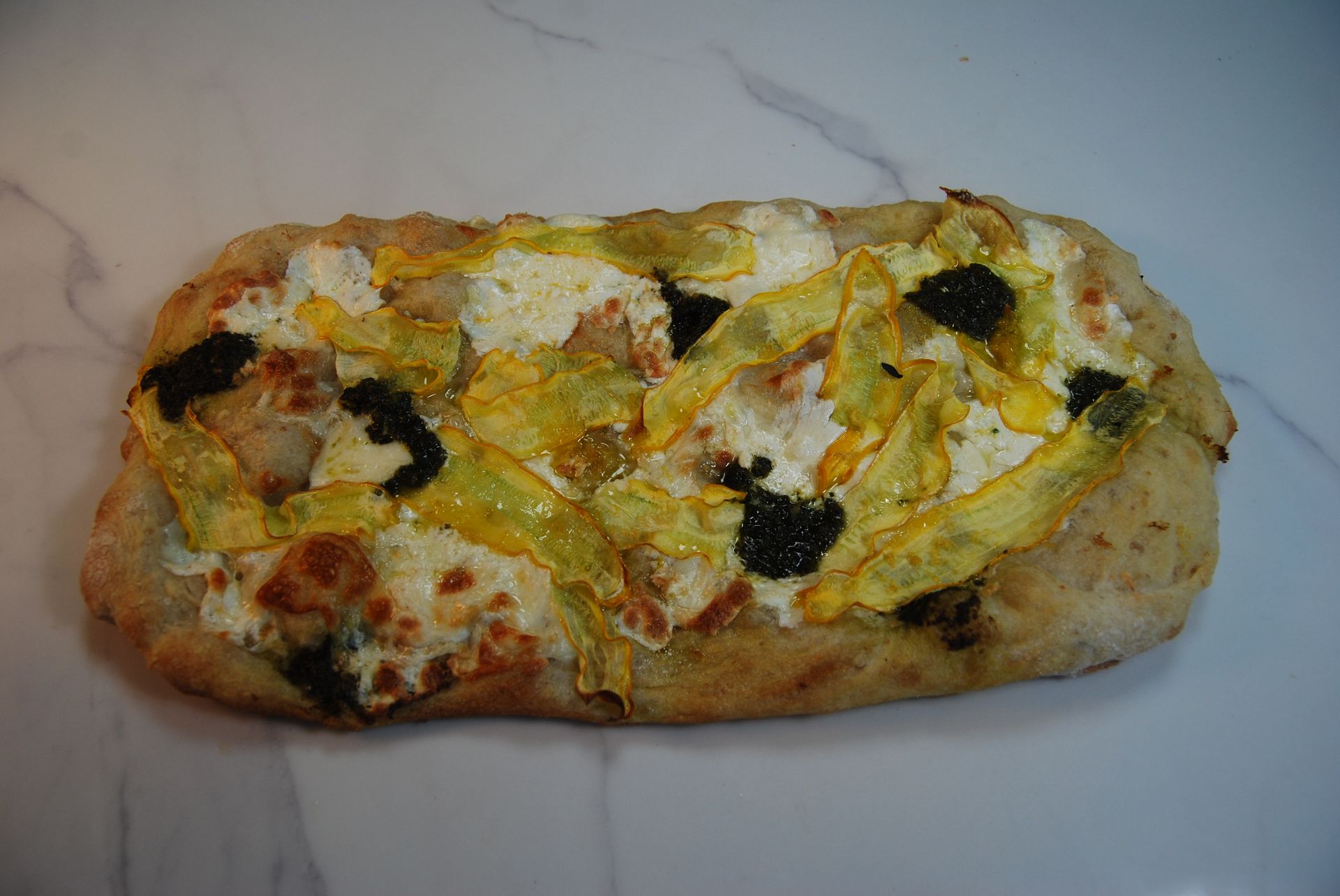 A pizza with a lot of toppings on it