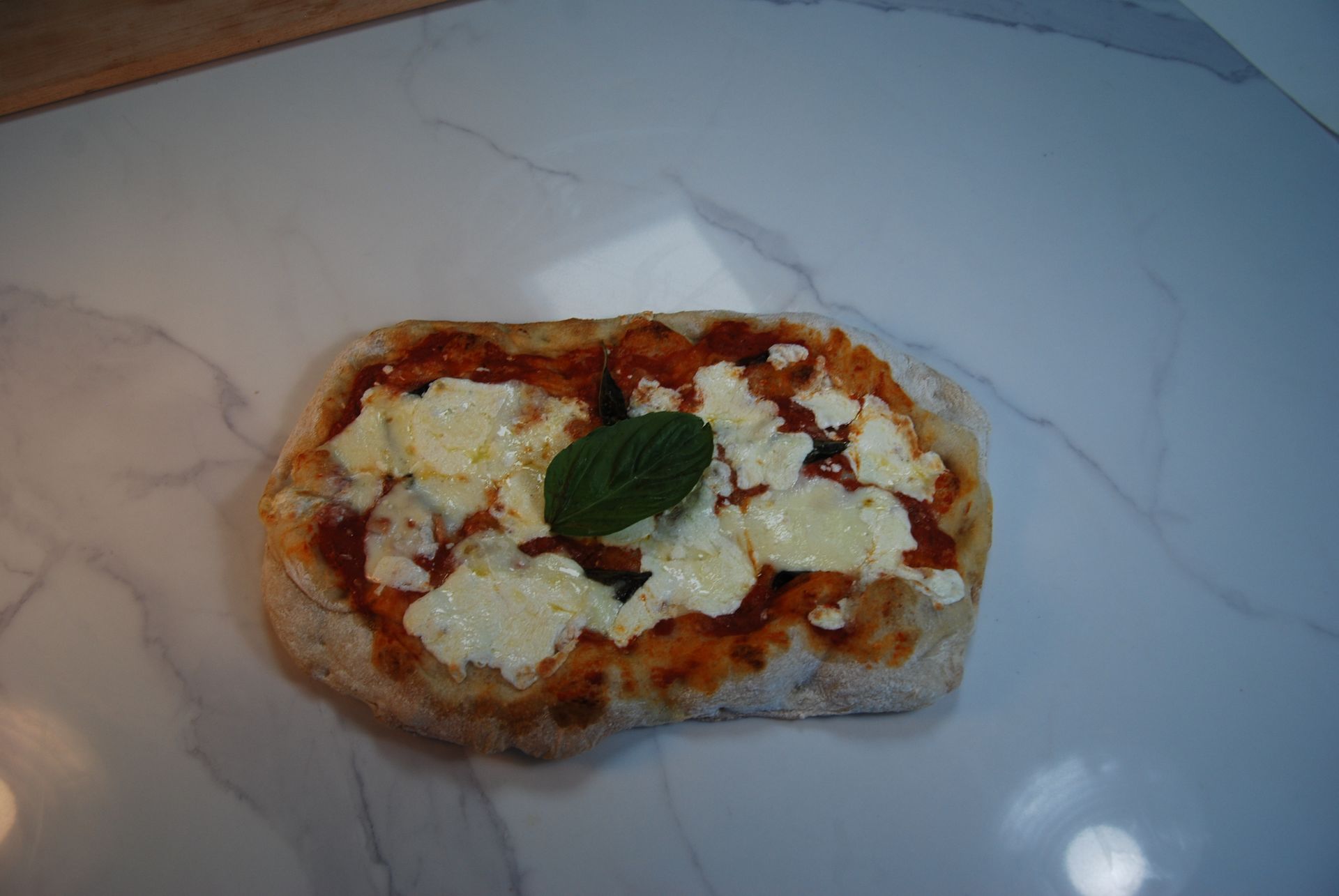 A pizza with tomato sauce and cheese on it