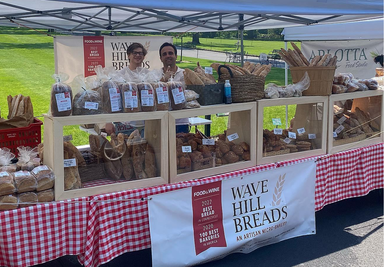 A bread stand with a sign that says iowa hill breads