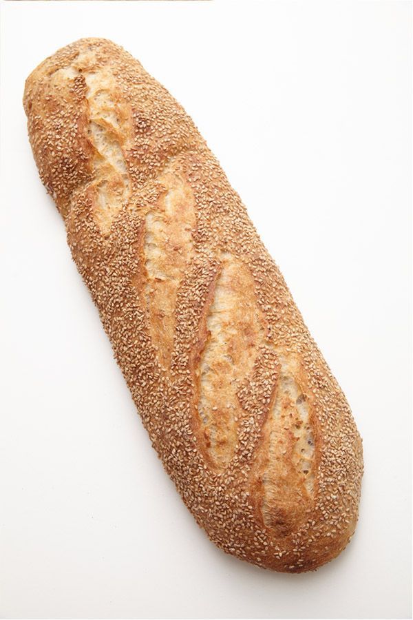 A loaf of bread with sesame seeds on it