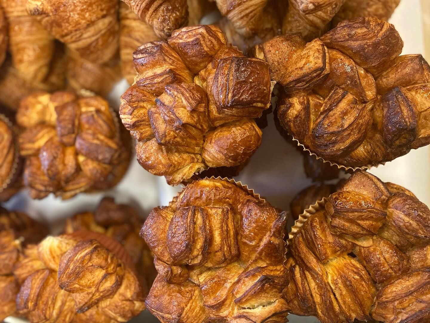 A bunch of pastries are sitting on top of each other