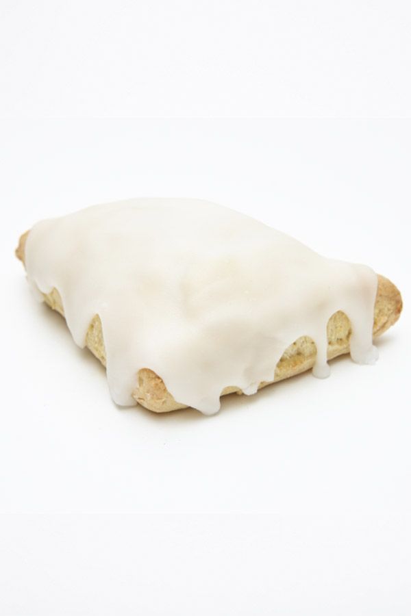 A pastry with icing on it on a white background