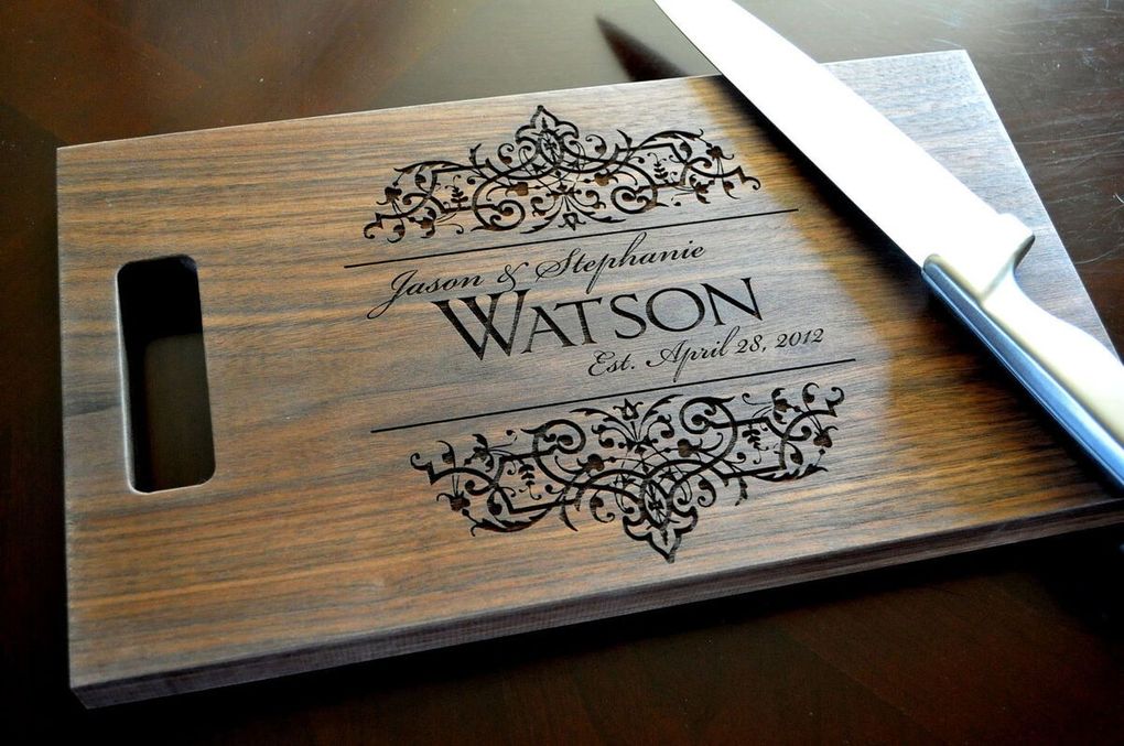 A wooden cutting board with the name watson on it